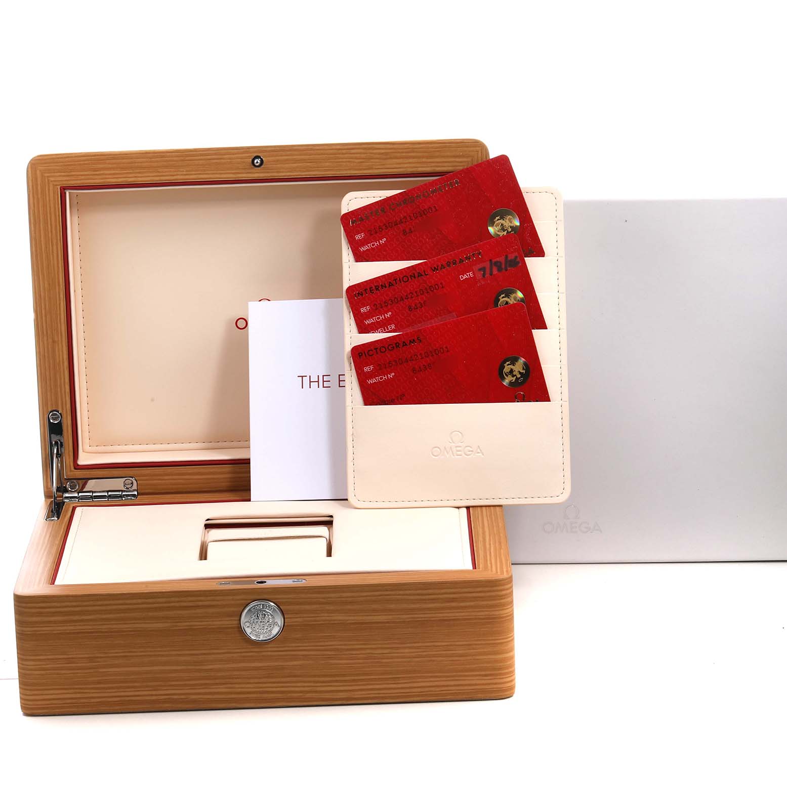 The image shows the Omega Seamaster 215.30.44.21.01.001 Men's Stainless Steel Black Dial's open wooden box, warranty cards, and an instruction manual.