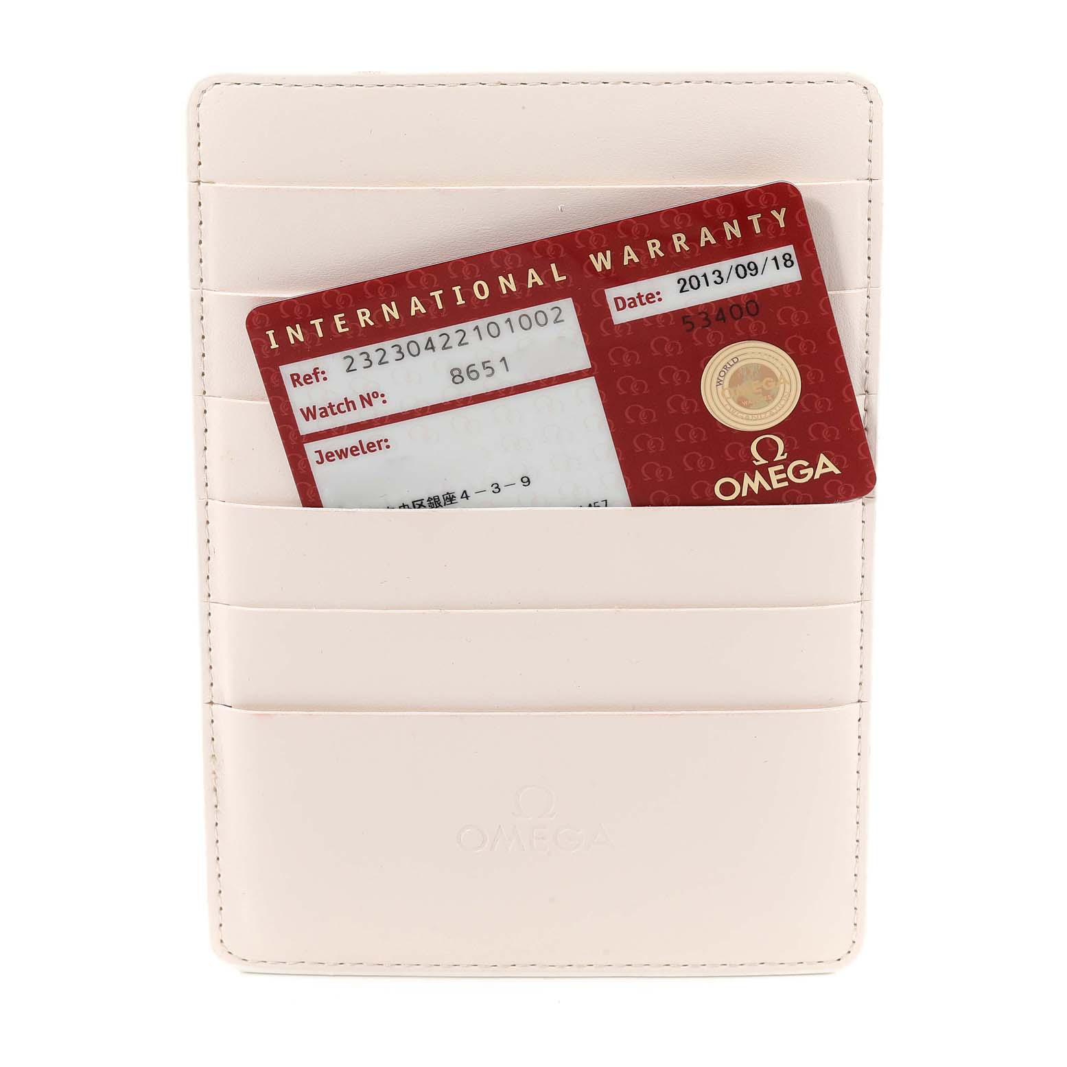 The image shows an Omega Planet Ocean 232.30.42.21.01.002 Men
s Stainless Steel Black Dial 232.30.42.21.01.002 Men
s Stainless Steel Black Dial model
s international warranty card inside a white cardholder.