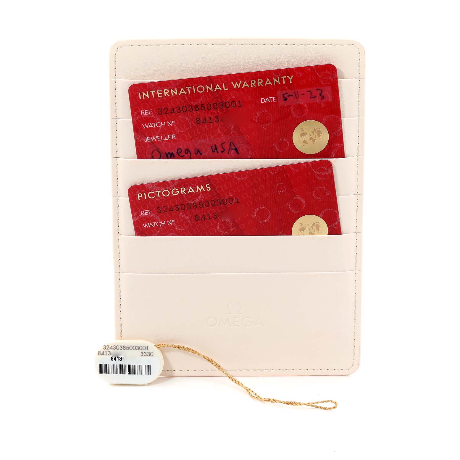 This image shows the warranty and pictogram cards for an Omega Speedmaster 324.30.38.50.03.001 Men
s Stainless Steel Blue Dial 324.30.38.50.03.001 Men
s Stainless Steel Blue Dial watch along with a tag, all displayed in a cardholder.