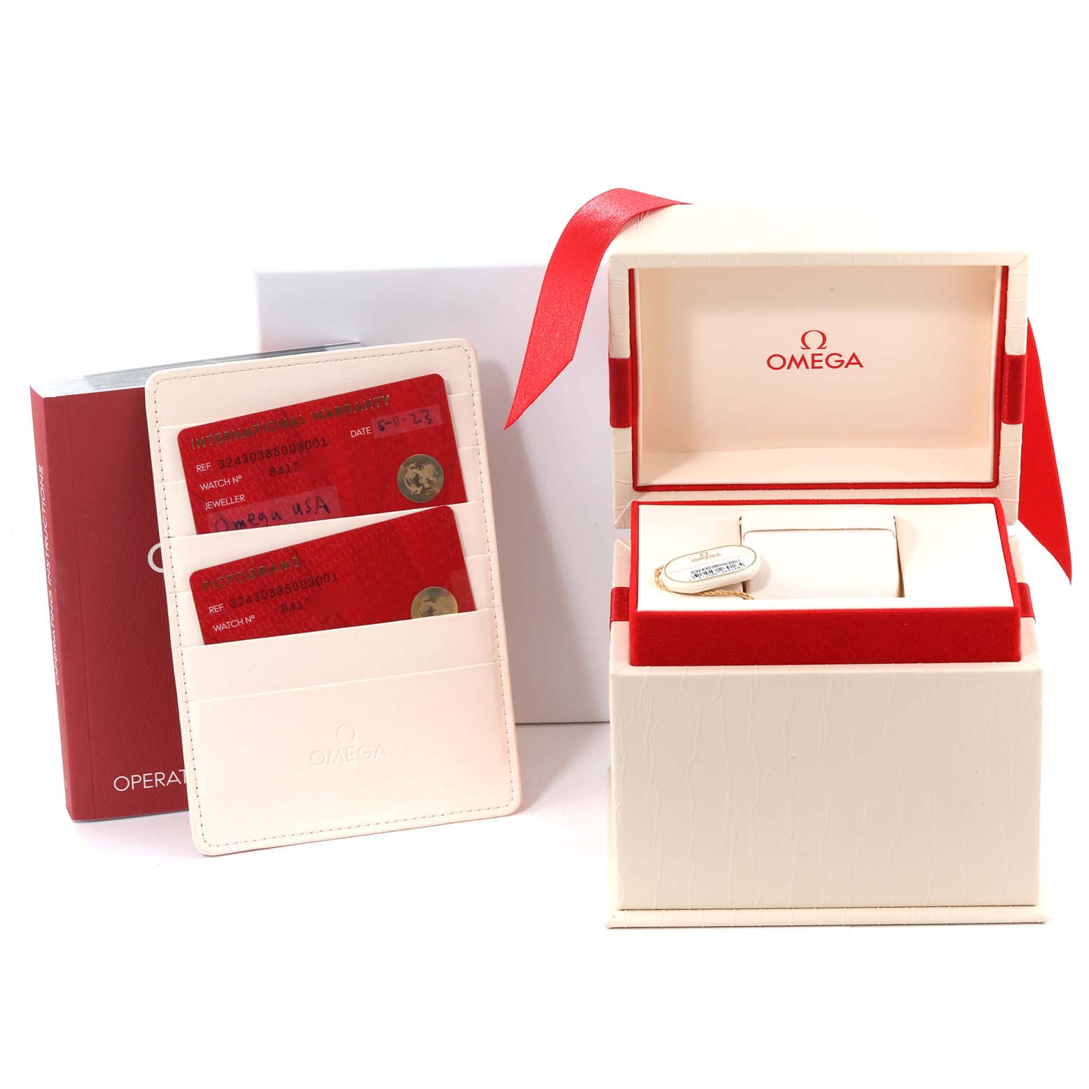 This image shows the packaging and accessories for the Omega Speedmaster 324.30.38.50.03.001 Men
s Stainless Steel Blue Dial 324.30.38.50.03.001 Men
s Stainless Steel Blue Dial, including the box, warranty cards, and user manual.