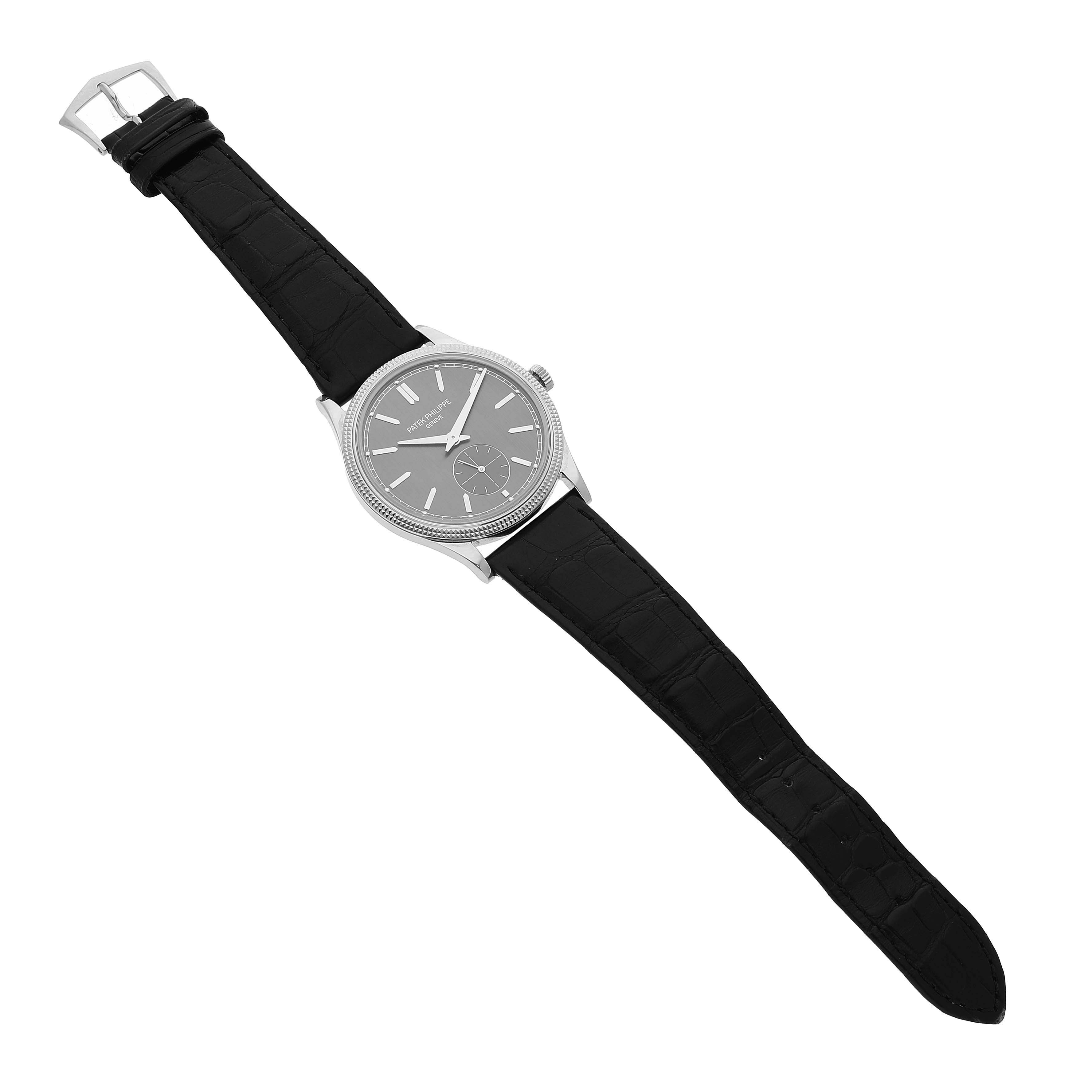 The Patek Philippe Calatrava 6119G-001 Men's White Gold Grey Dial watch is shown at an overhead angle, displaying the full face, bezel, and black leather strap.