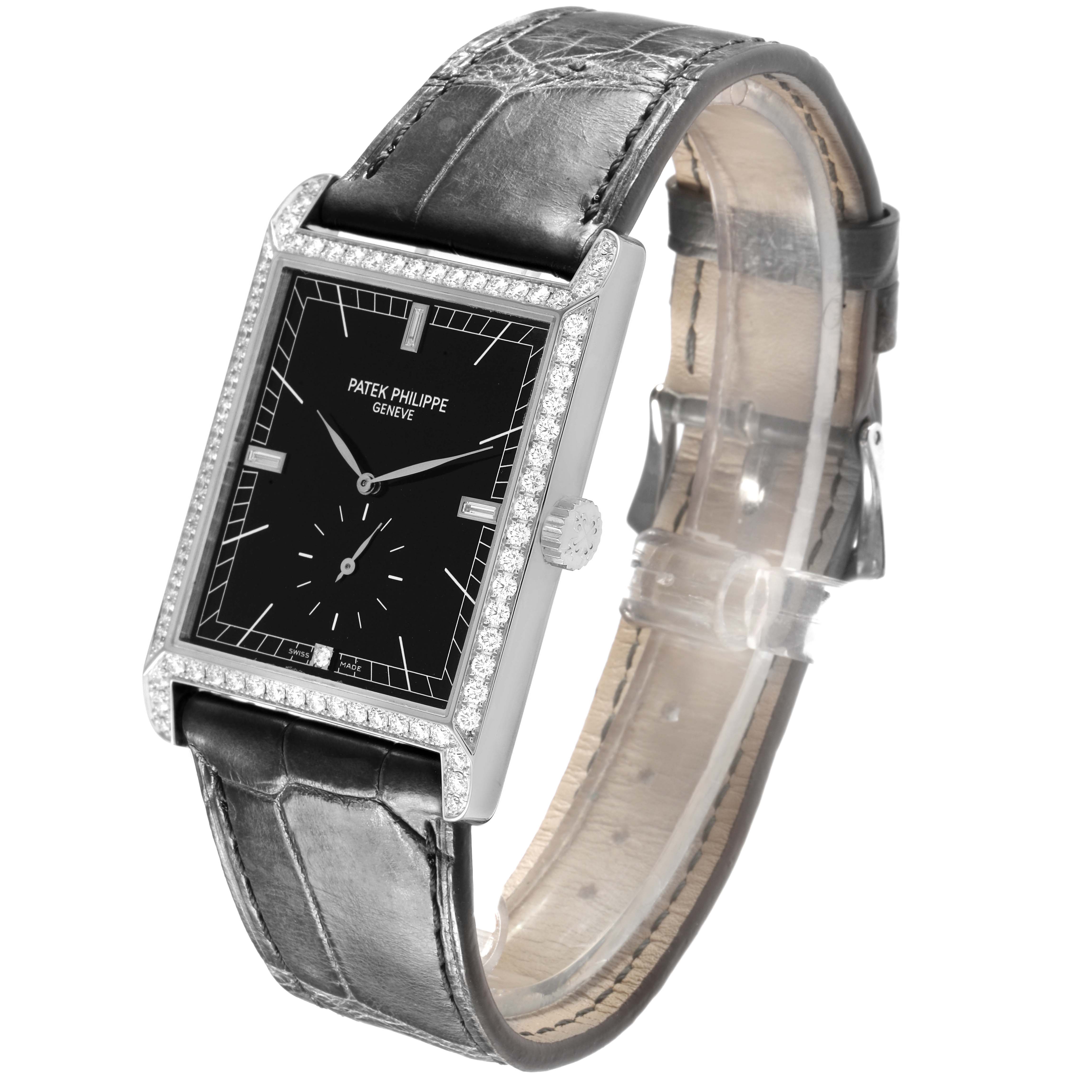The Patek Philippe Gondolo 5112G Men's White Gold Black Dial watch is shown at a front angle, highlighting its rectangular dial, diamond bezel, and leather strap.