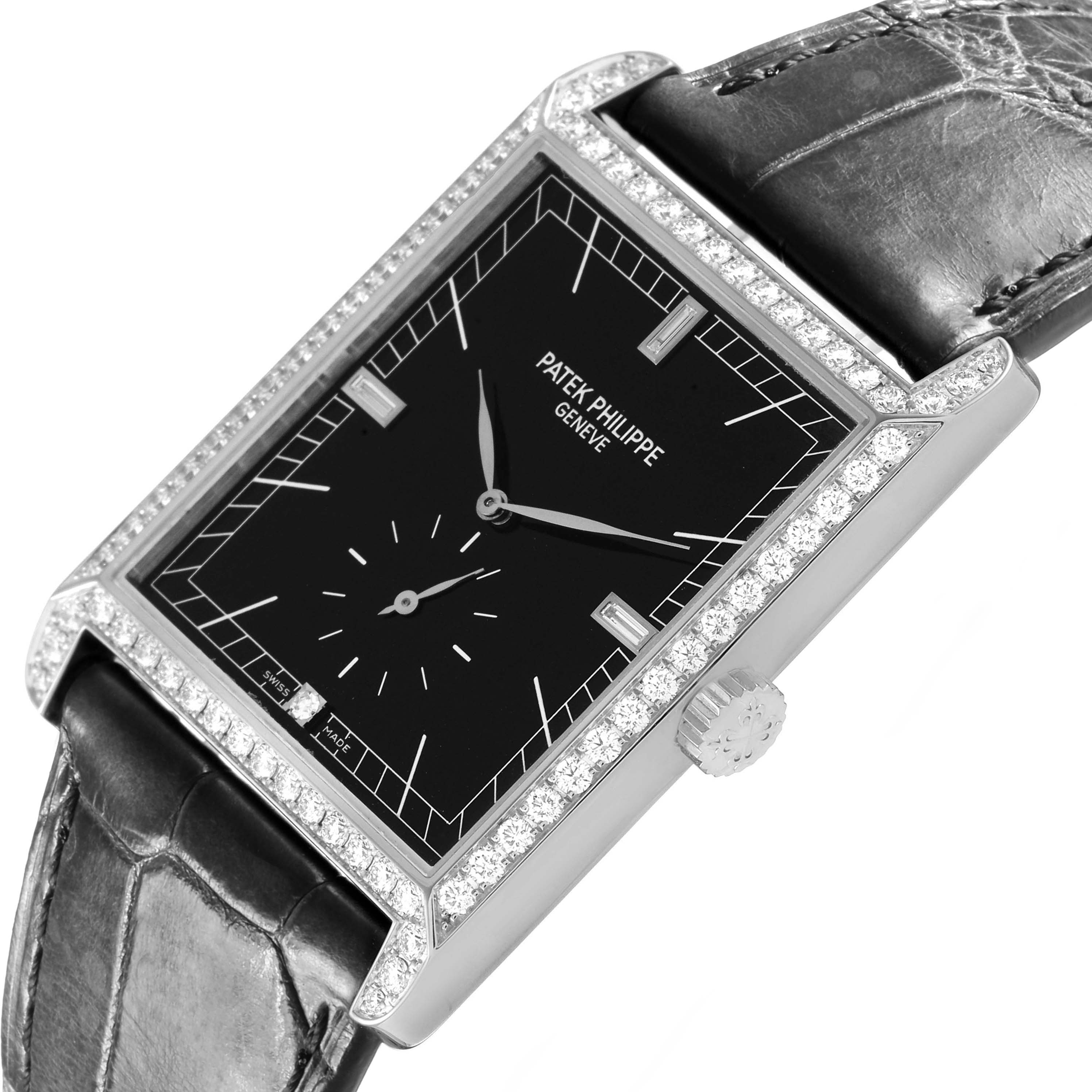The Patek Philippe Gondolo 5112G Men's White Gold Black Dial watch is shown at an angled view, highlighting its rectangular dial, diamond bezel, crown, and leather strap.