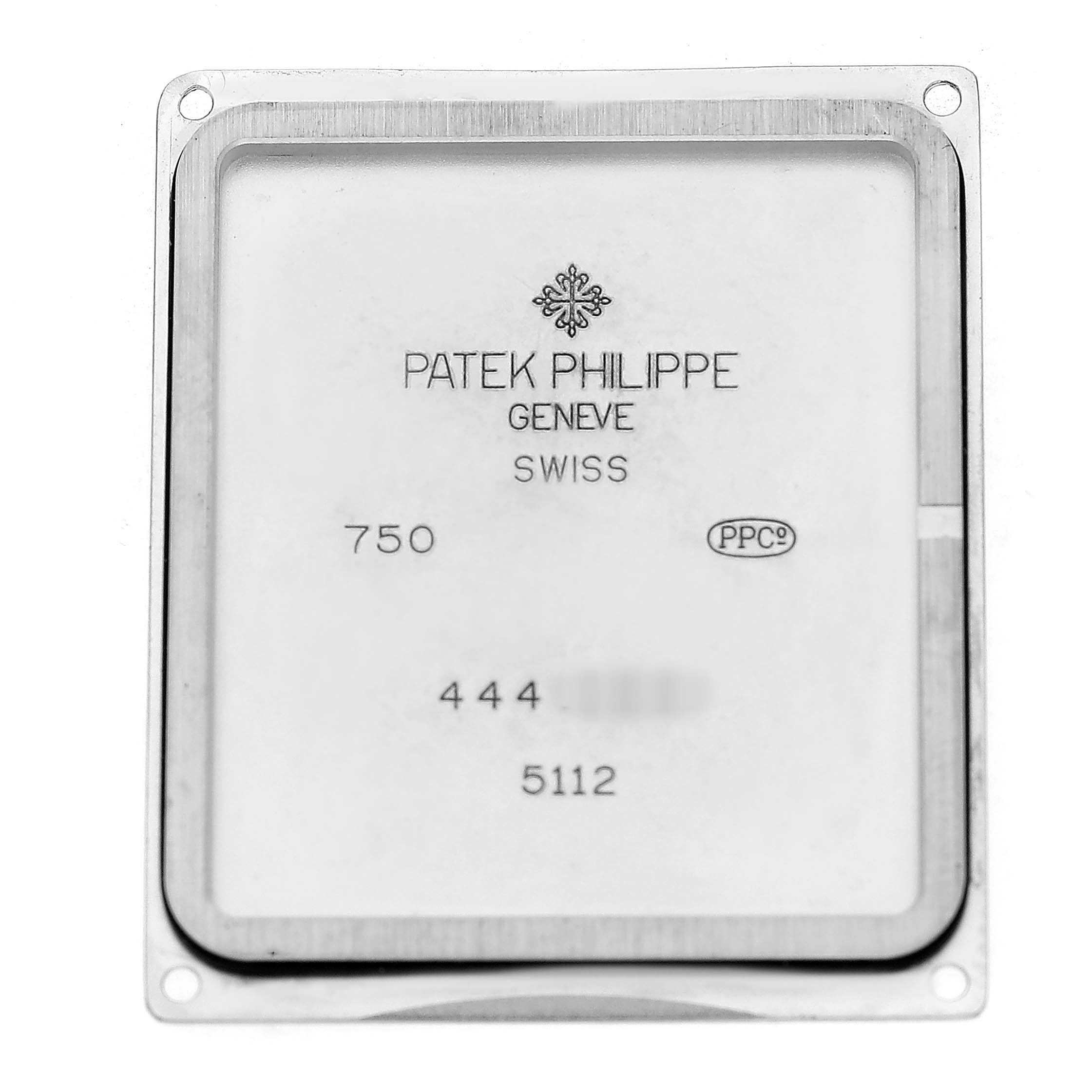 This image shows the back case of a Patek Philippe Gondolo 5112G Men's White Gold Black Dial watch, displaying brand details and Swiss markings.