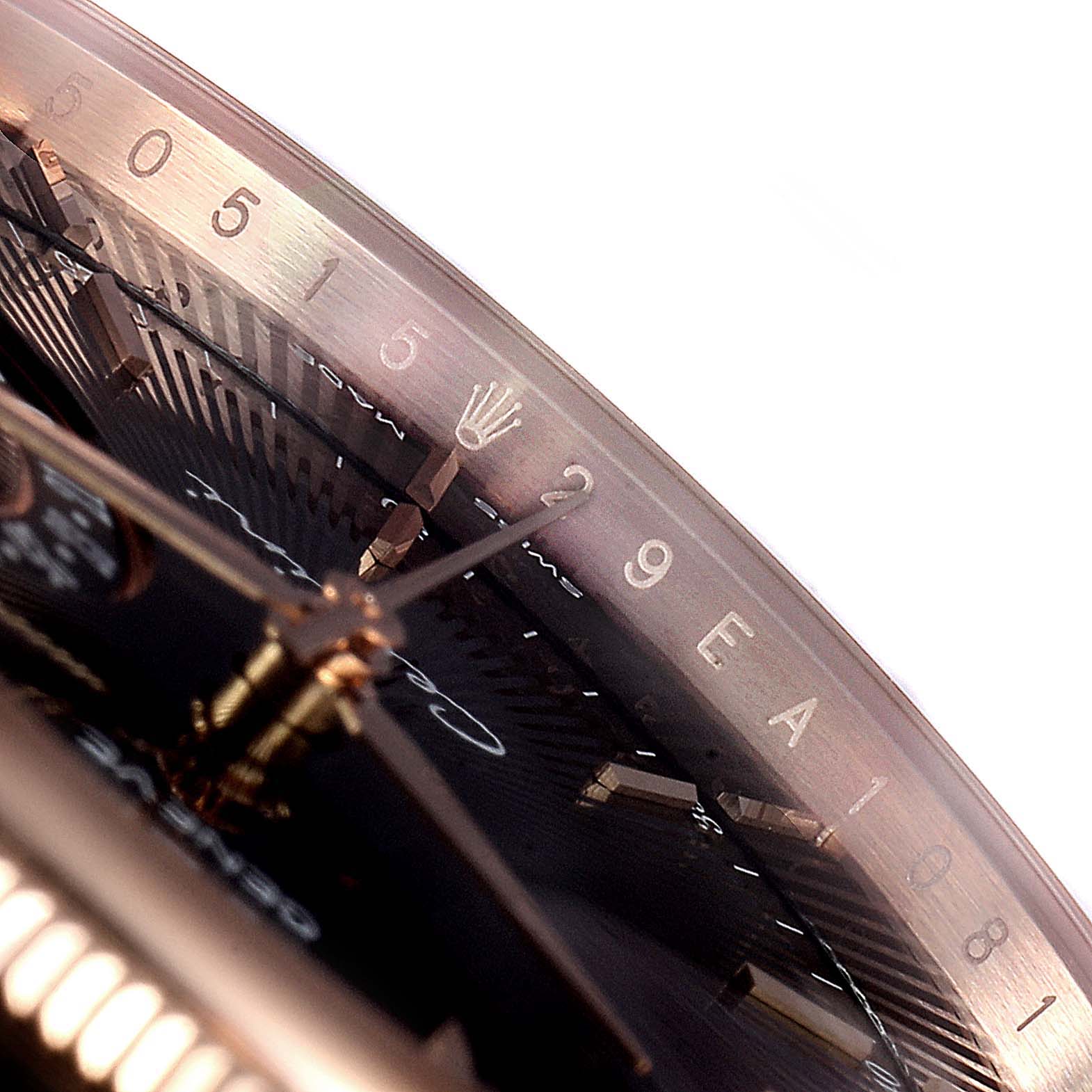 This close-up image of the Rolex Cellini 50515 Men's Rose Gold Black Dial 50515 Men's Rose Gold Black Dial watch shows part of the dial, hands, and a segment of the date display.