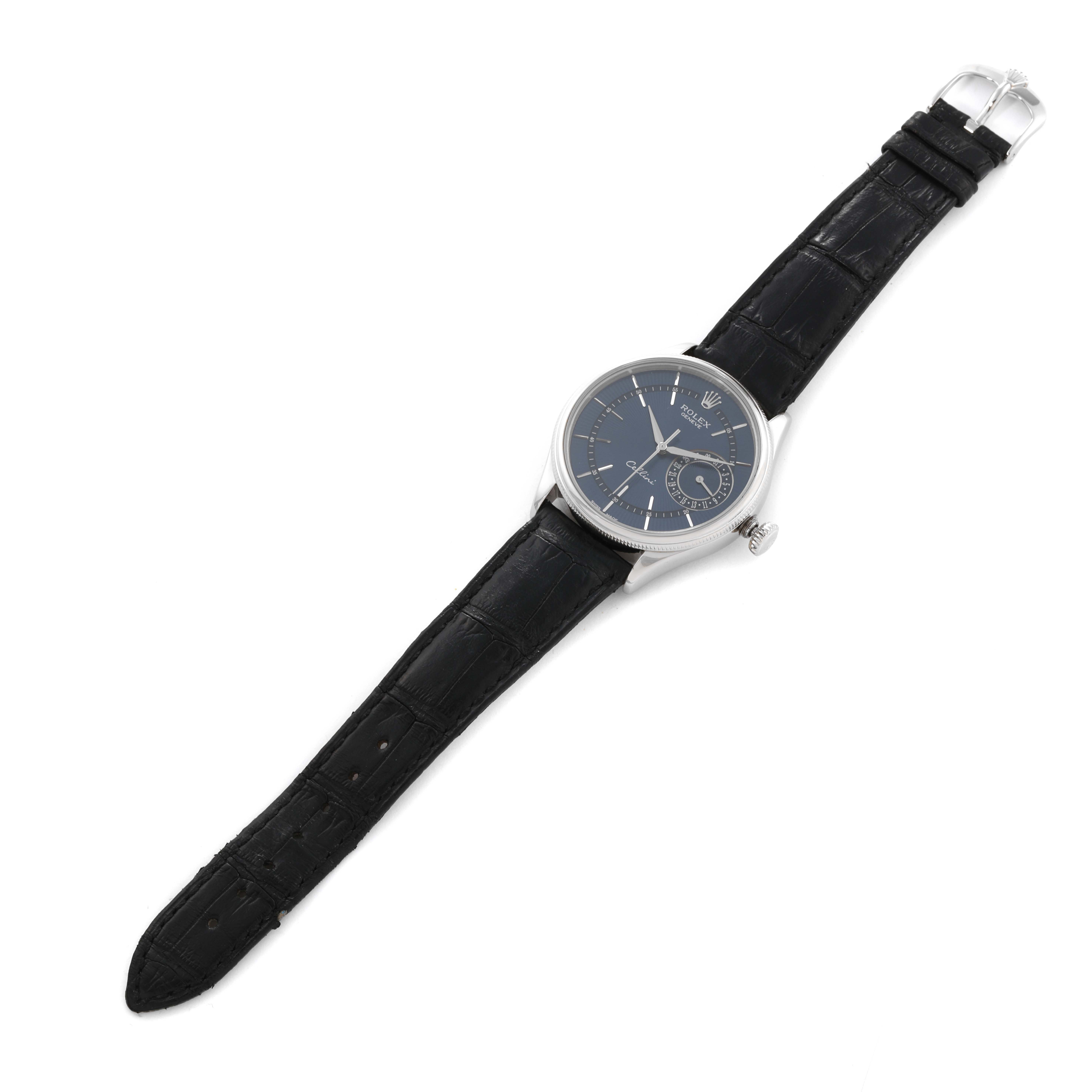 The Rolex Cellini 50519 Men's White Gold Blue Dial 50519 Men's White Gold Blue Dial watch is shown from an overhead angle, displaying its dial, case, and black leather strap.
