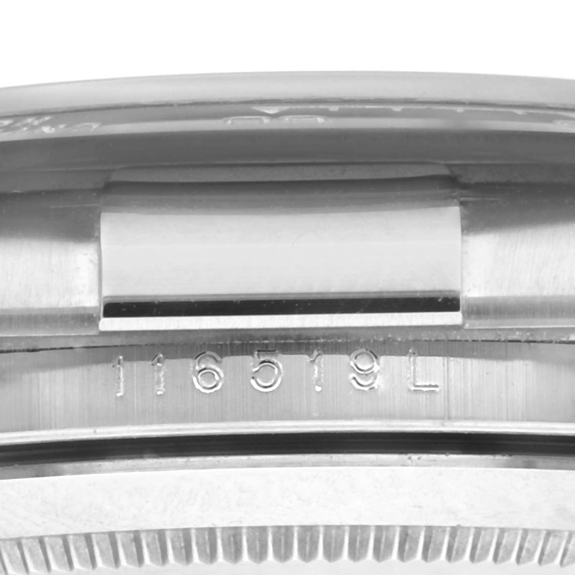 This image shows the side casing and serial number of a Rolex Daytona 116519 Men's White Gold Grey Dial 116519 Men's White Gold Grey Dial watch, model 116519.