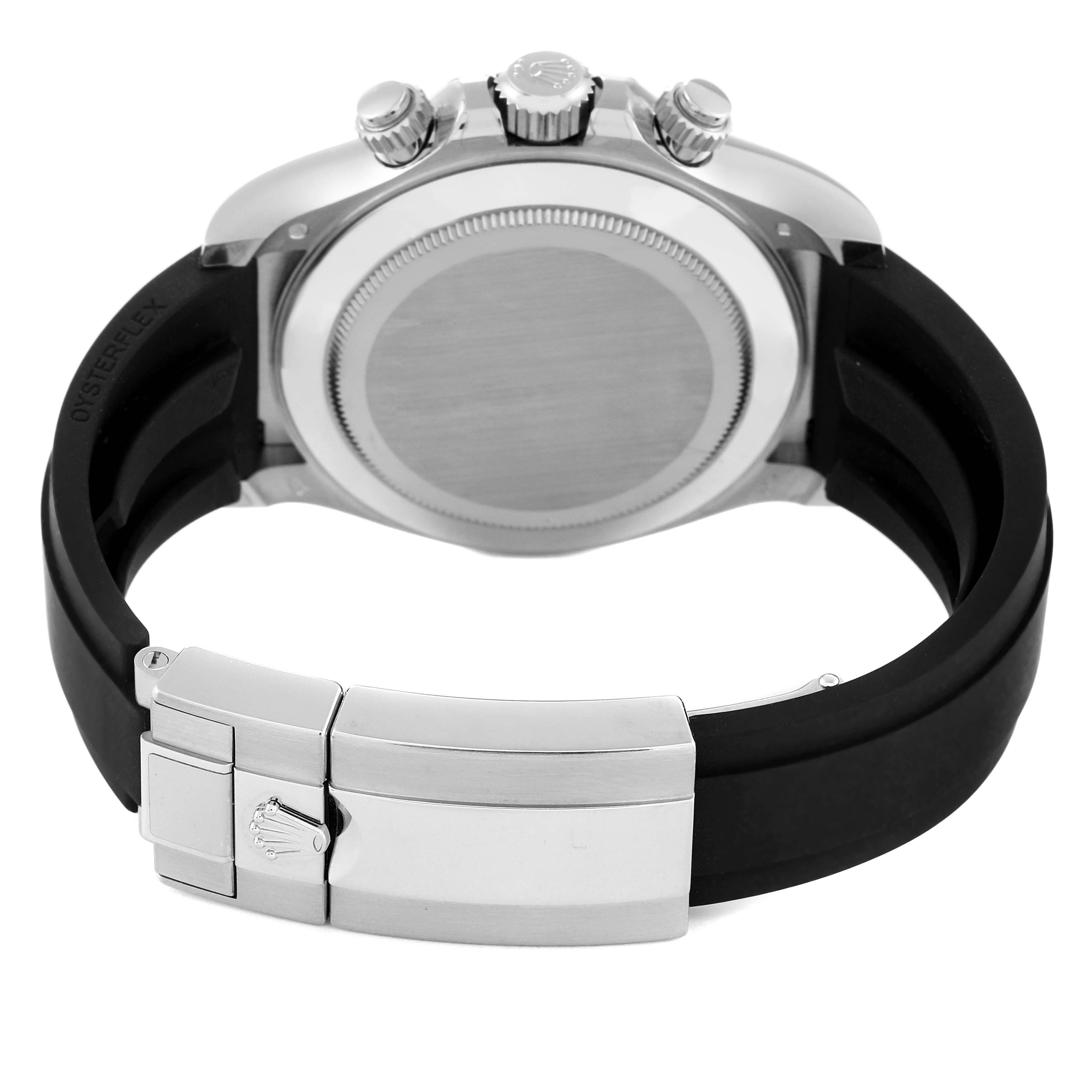 The image shows the backside and clasp of a Rolex Daytona 116519 Men's White Gold Grey Dial 116519 Men's White Gold Grey Dial watch, including the case back, crown, and black rubber strap.