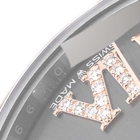 This image shows a close-up of the dial and part of the bezel on a Rolex Mid-Size 278341 Women's Steel and Gold (two tone) Grey Dial 278341 Women's Steel and Gold (two tone) Grey Dial watch, highlighting the 'IV' with diamonds and the "Swiss Made" marking.