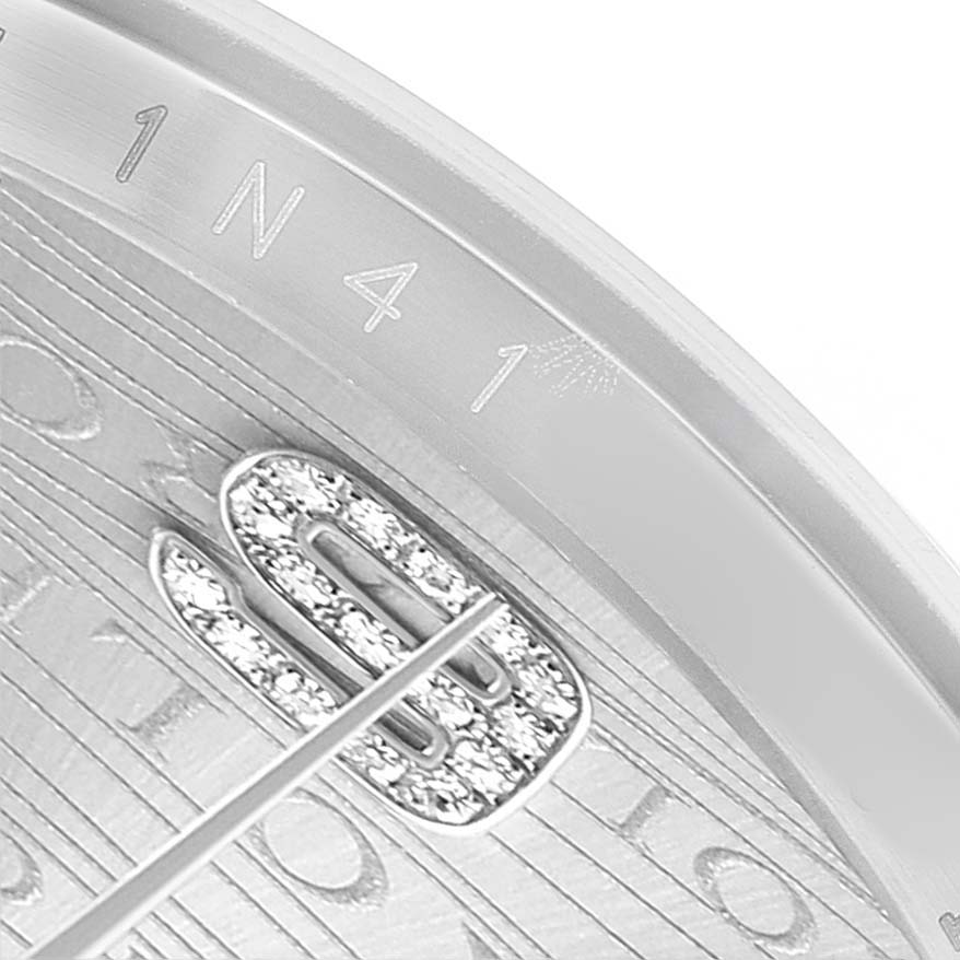 The image shows a close-up of the Rolex Datejust 116244 Men's Stainless Steel Silver Dial dial with diamond accents and partial bezel.