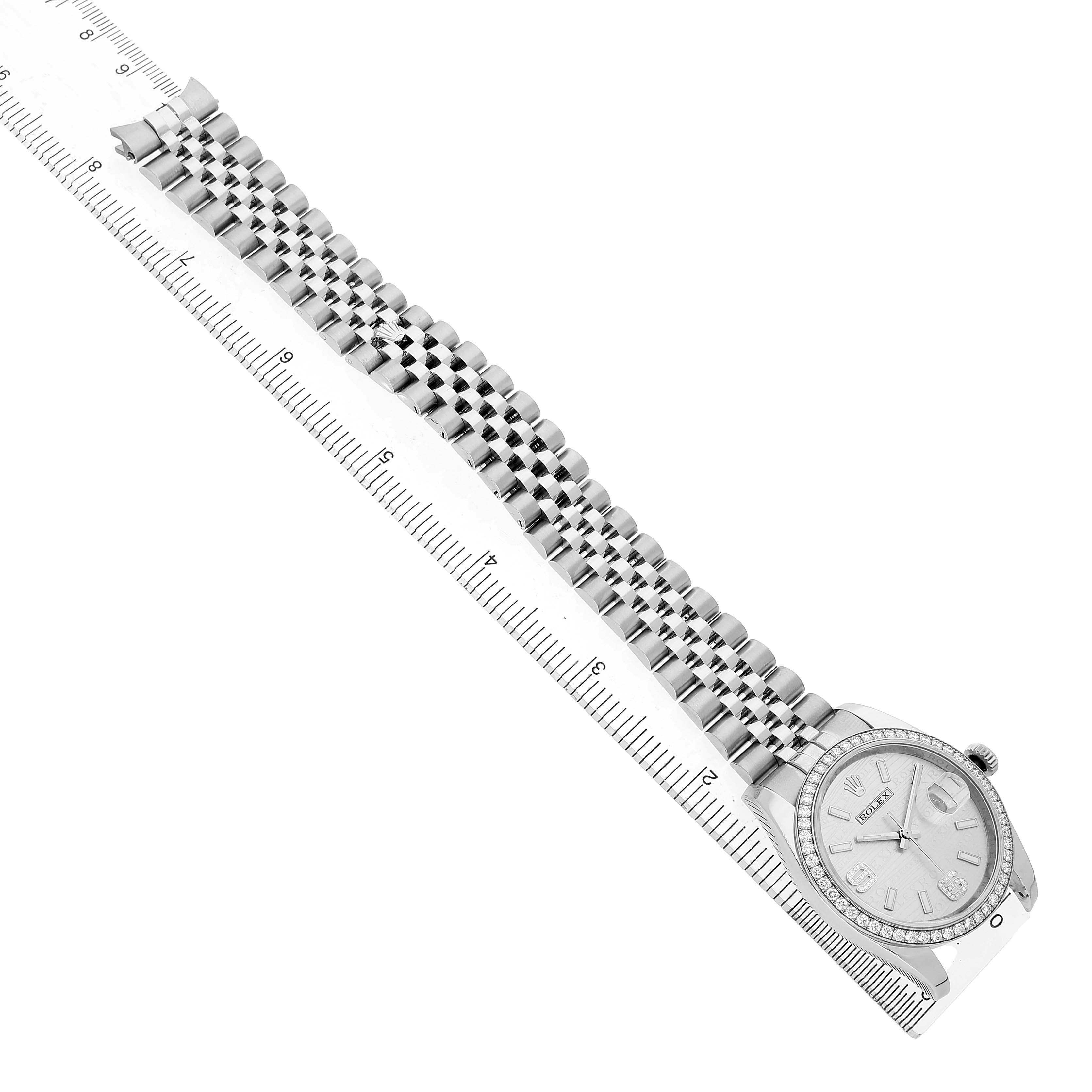 The Rolex Datejust 116244 Men's Stainless Steel Silver Dial watch is shown from a top angle, highlighting its band, case, and face next to a ruler for scale.
