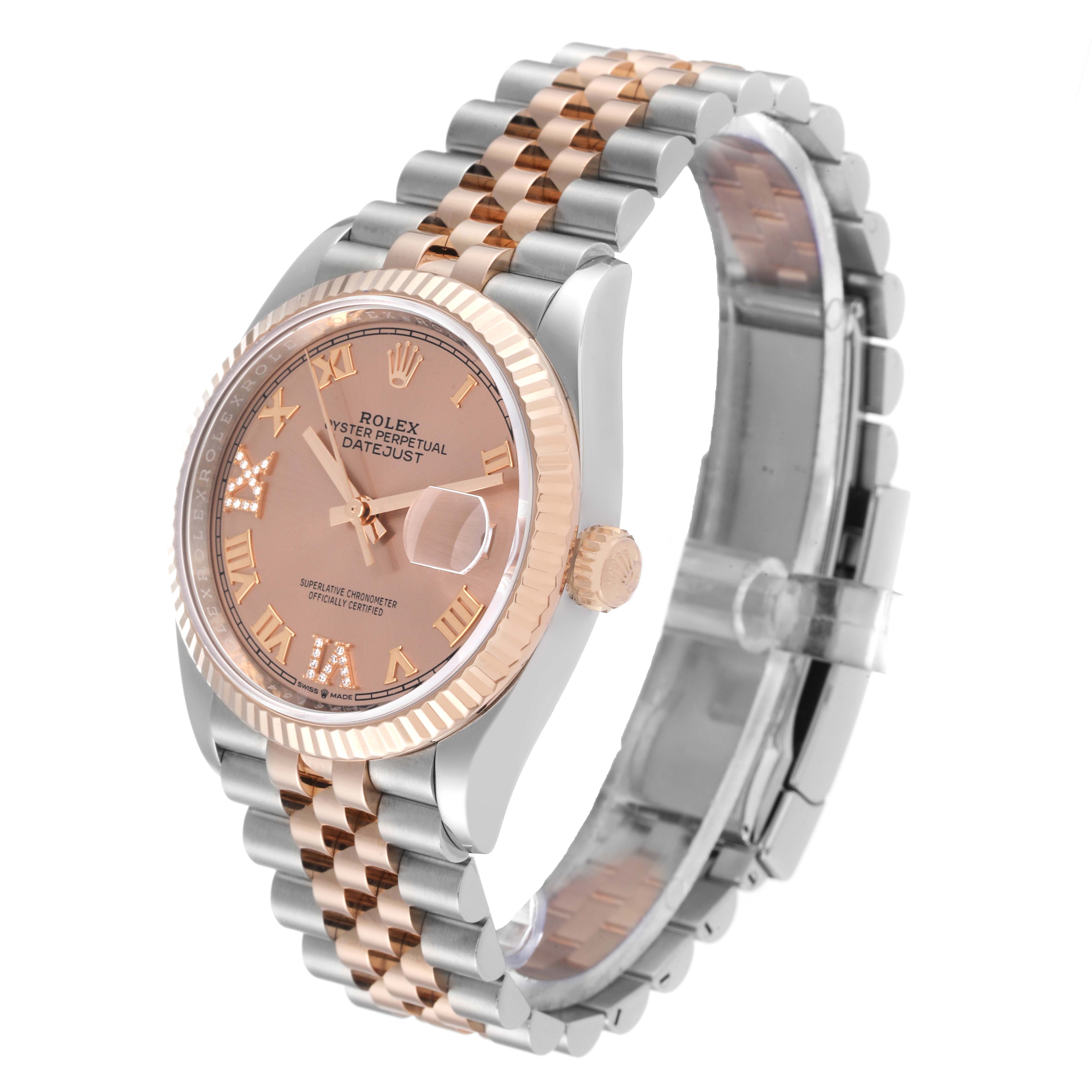 This is a Rolex Datejust 126231 Men's Steel and Gold (two tone) Pink Dial 126231 Men's Steel and Gold (two tone) Pink Dial watch shown at a three-quarter angle, highlighting its dial, bezel, and two-tone bracelet.