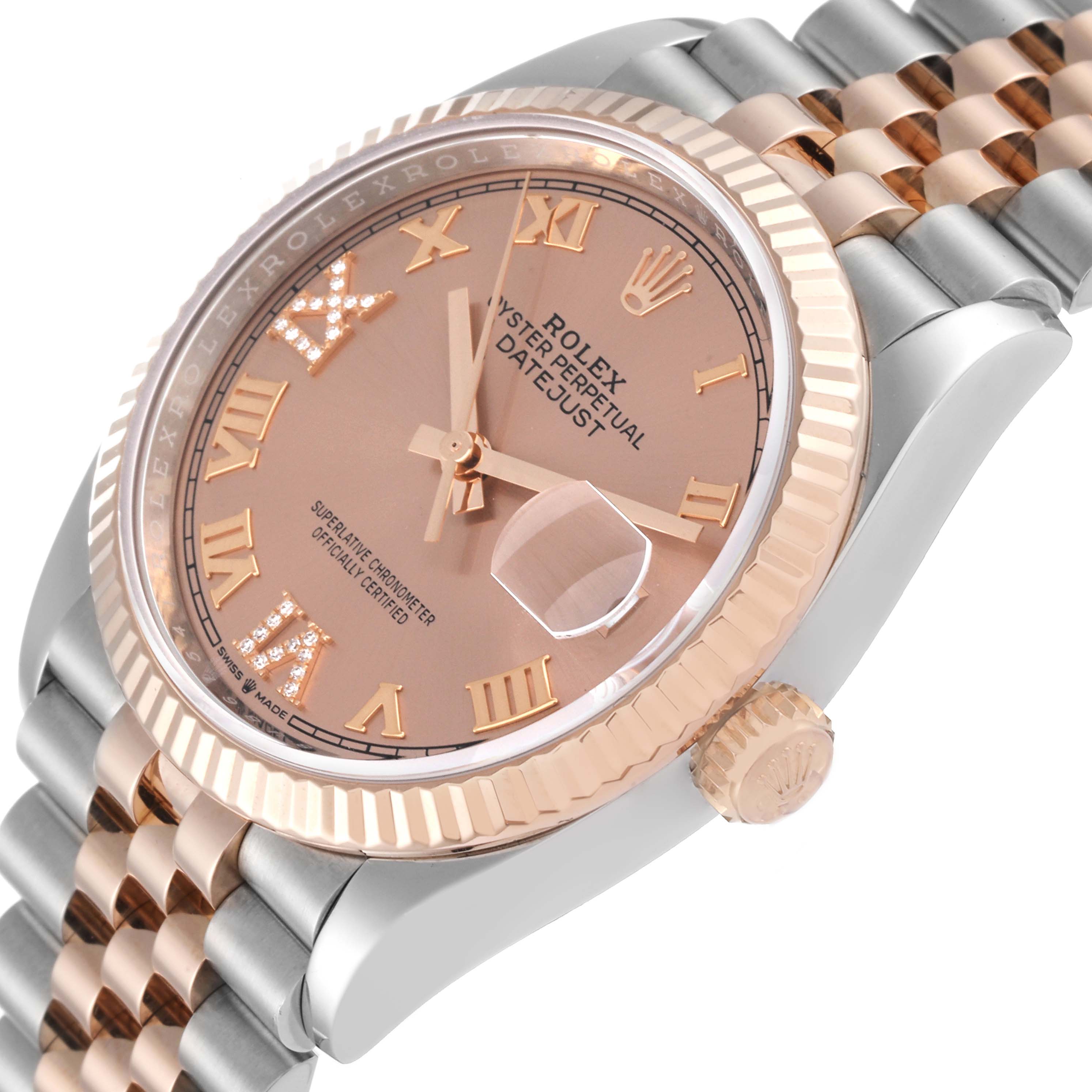 The image shows a close-up angled view of a Rolex Datejust 126231 Men's Steel and Gold (two tone) Pink Dial 126231 Men's Steel and Gold (two tone) Pink Dial watch, highlighting the dial, bezel, crown, and part of the bracelet.