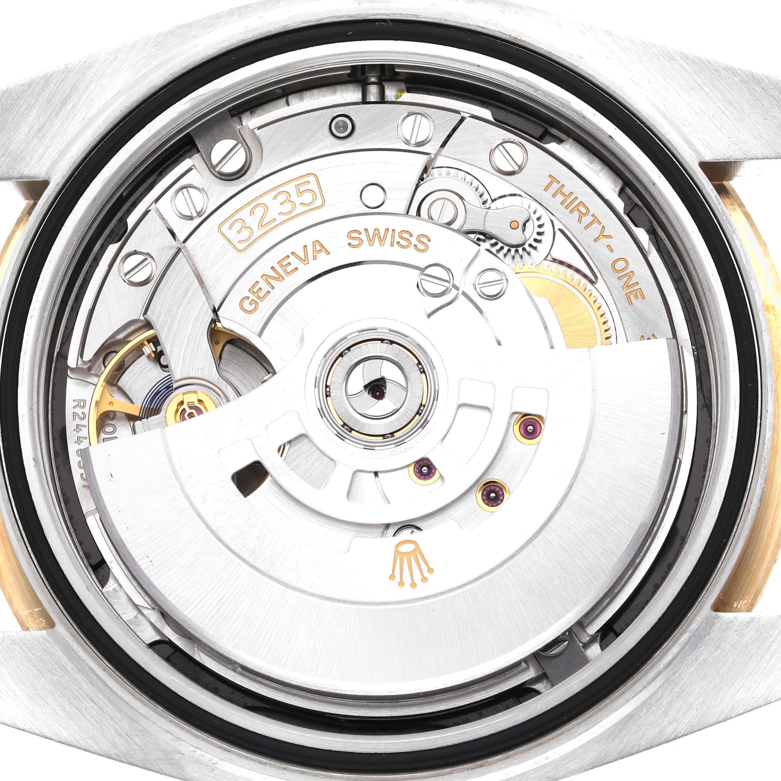 This image shows the movement and internal mechanics of a Rolex Datejust 41 126333 Men's Steel and Gold (two tone) Black Dial 126333 Men's Steel and Gold (two tone) Black Dial watch from a rear angle.