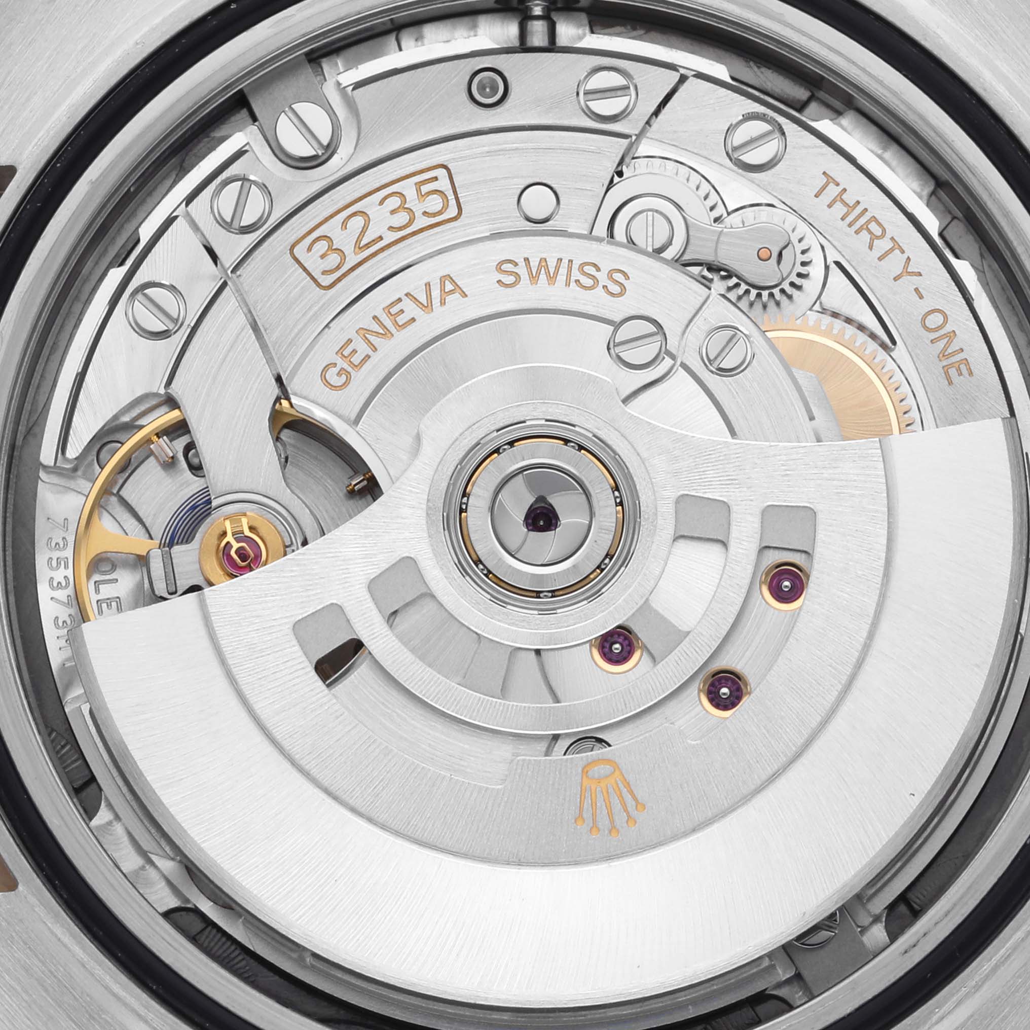 This is an image of the Rolex Datejust 41 126303 Men's Steel and Gold (two tone) Grey Dial 126303 Men's Steel and Gold (two tone) Grey Dial model's movement, highlighting the intricacies of its mechanical components.