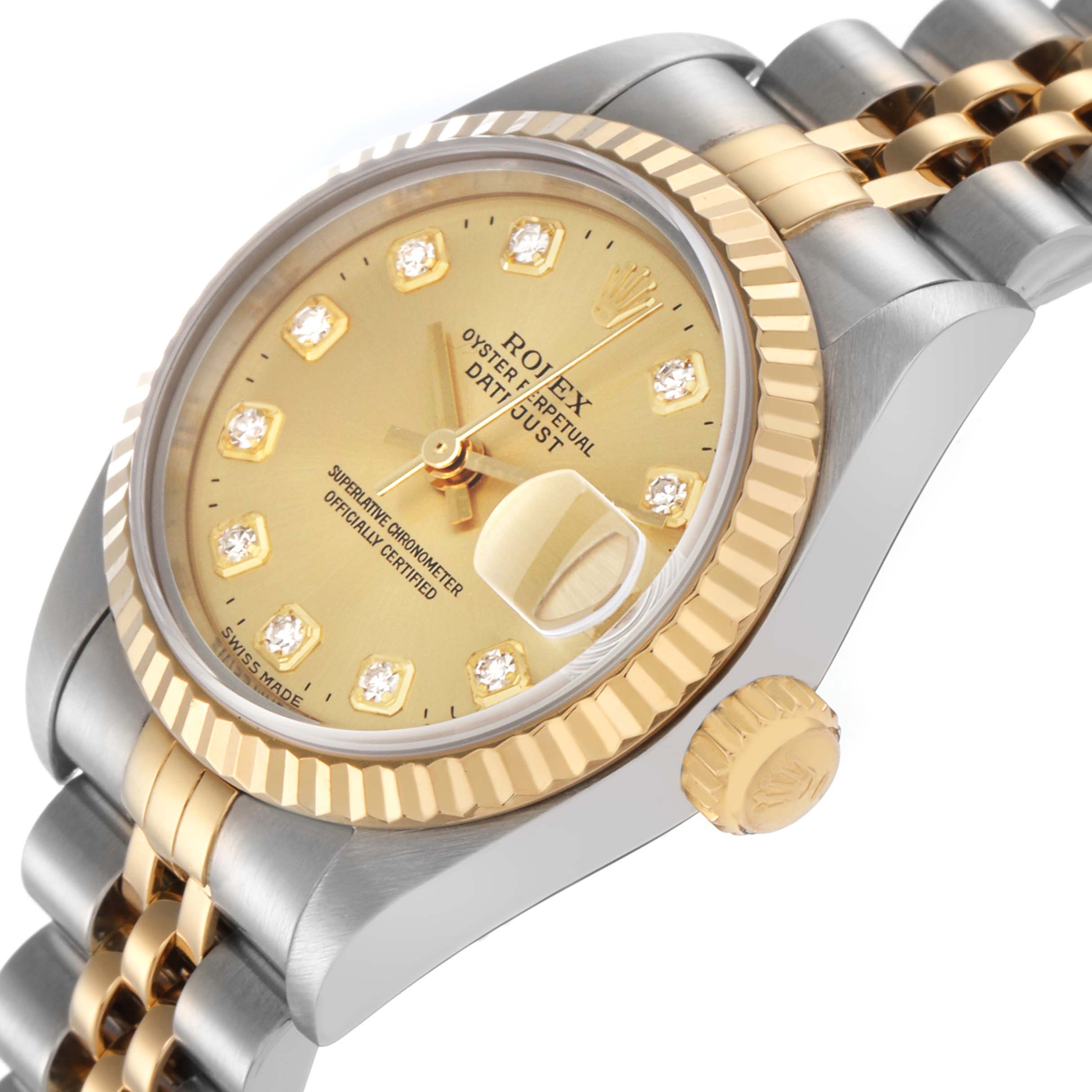 The Rolex Datejust 79173 Women's Steel and Gold (two tone) Champagne Dial 79173 Women's Steel and Gold (two tone) Champagne Dial watch is shown at an angled side view, highlighting the gold dial, fluted bezel, crown, and part of the Jubilee bracelet.