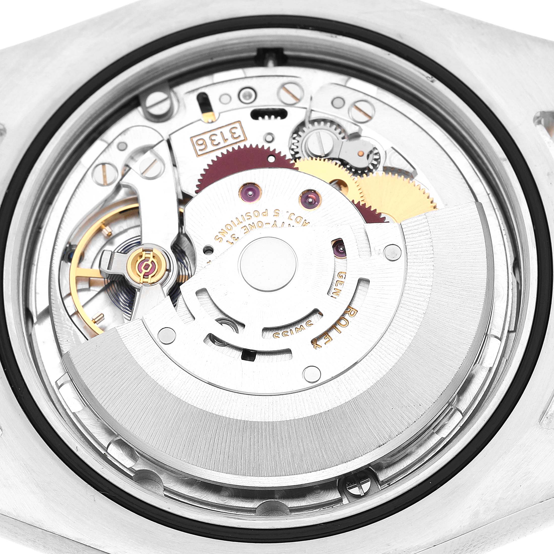 The image shows the movement of a Rolex Datejust 41 116333 Men's Steel and Gold (two tone) Black Dial, focusing on the rotor and gear mechanisms from the back.