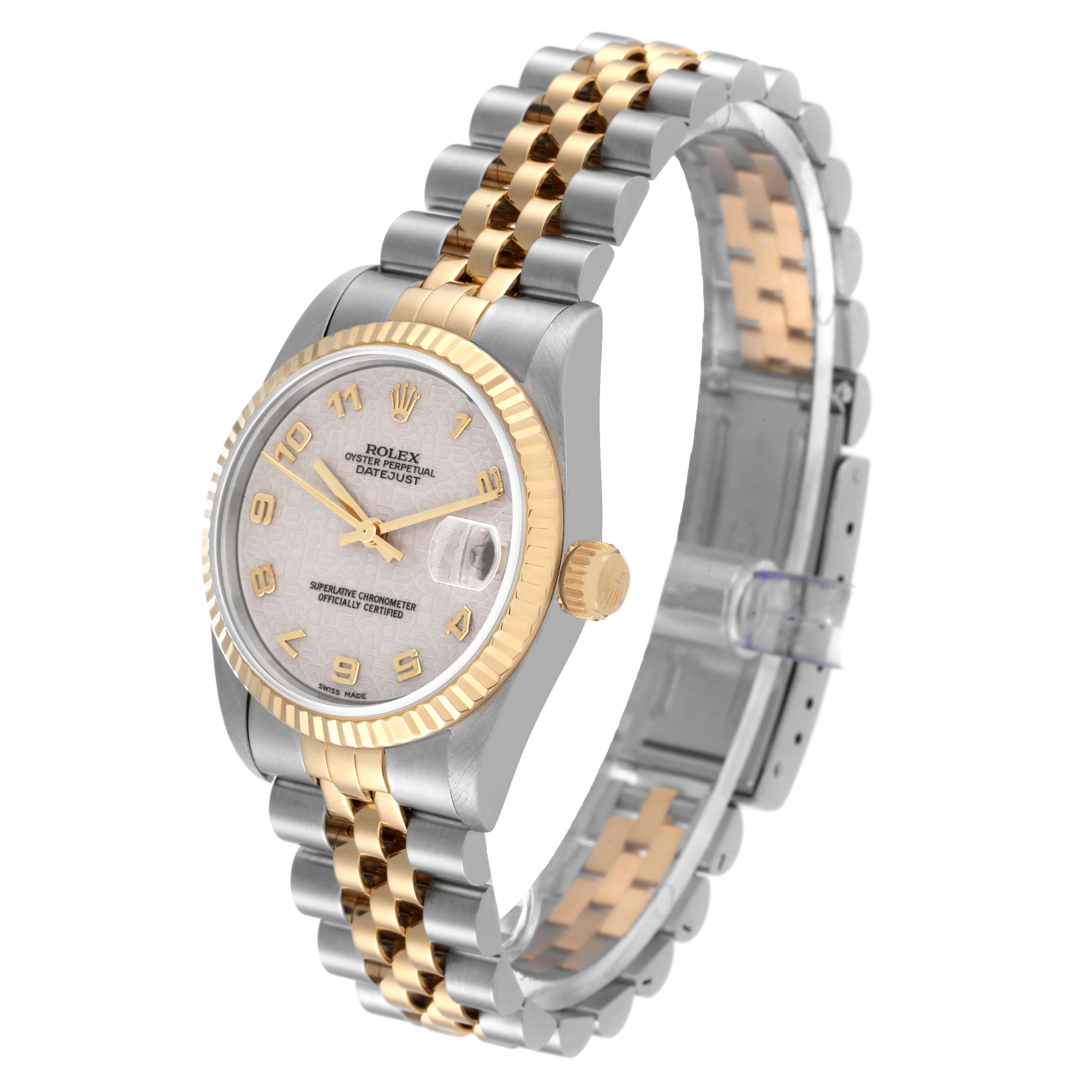 This Rolex Mid-Size 68273 Women
s Steel and Gold (two tone) White Dial 68273 Women
s Steel and Gold (two tone) White Dial watch is displayed at a three-quarter angle, showing the face, bezel, crown, and two-tone bracelet.