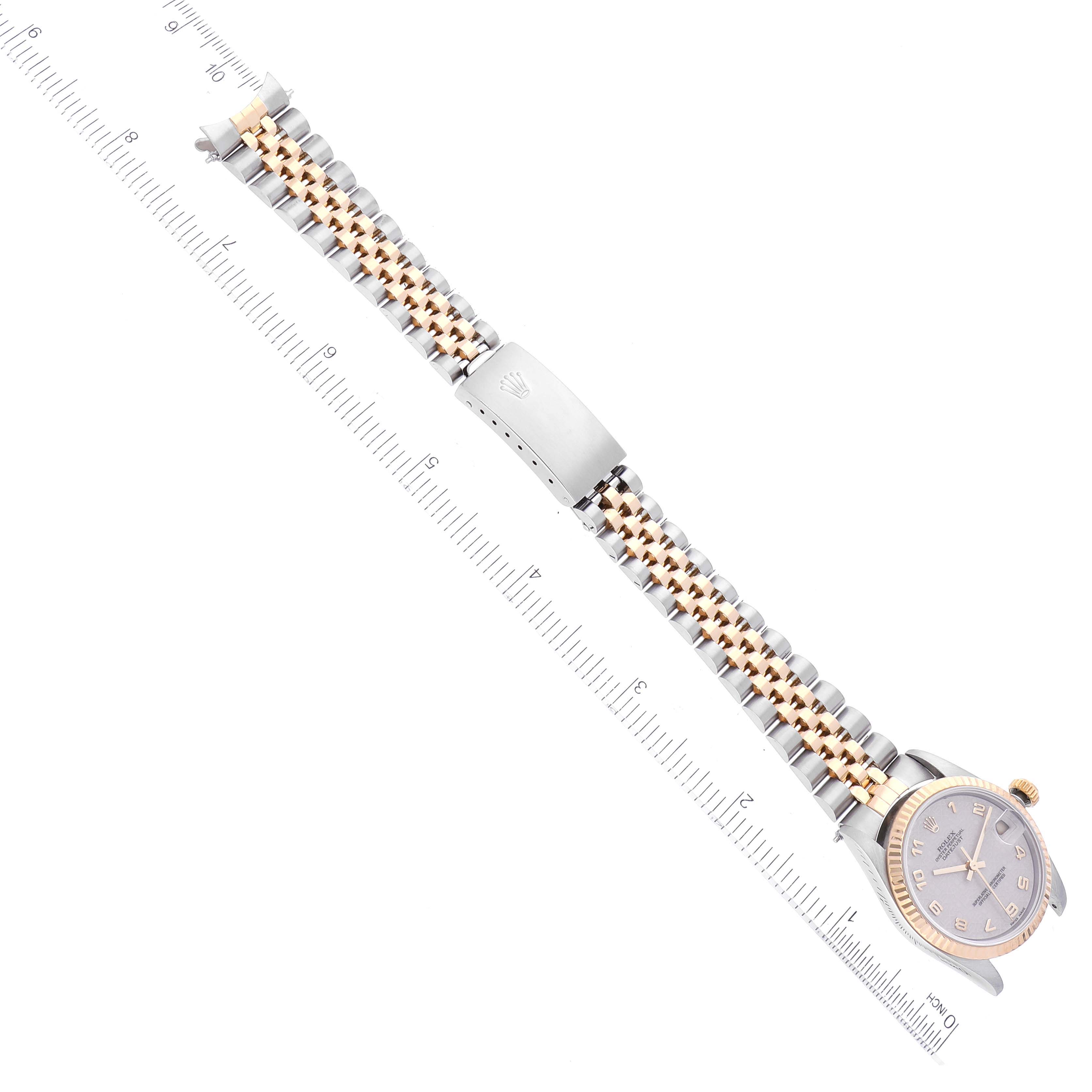 This image shows an overhead view of a Rolex Mid-Size 68273 Women
s Steel and Gold (two tone) White Dial 68273 Women
s Steel and Gold (two tone) White Dial watch, displaying the face, bezel, and bracelet in detail.