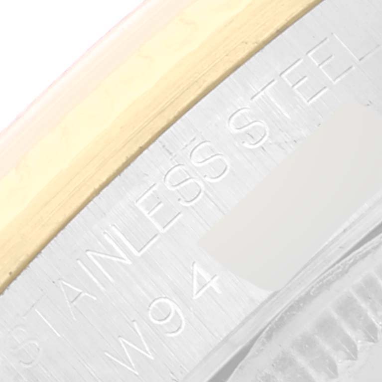 This image shows a close-up of the engraved text on the stainless steel and gold bezel of a Rolex Mid-Size 68273 Women
s Steel and Gold (two tone) White Dial 68273 Women
s Steel and Gold (two tone) White Dial model.