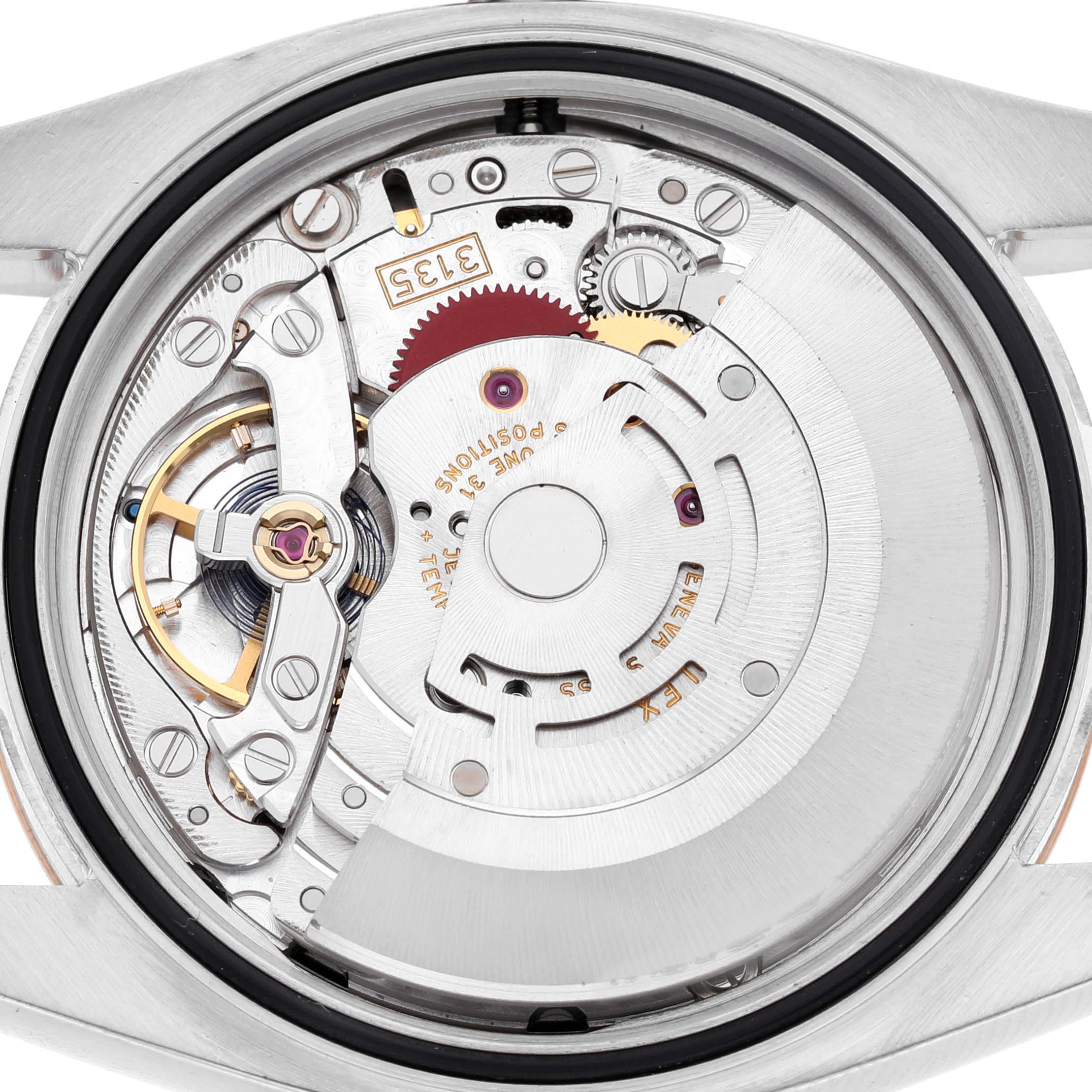 The image shows a Rolex Datejust 116231 Men's Steel and Gold (two tone) Black Dial watch from the back, highlighting its internal movement and mechanical components.