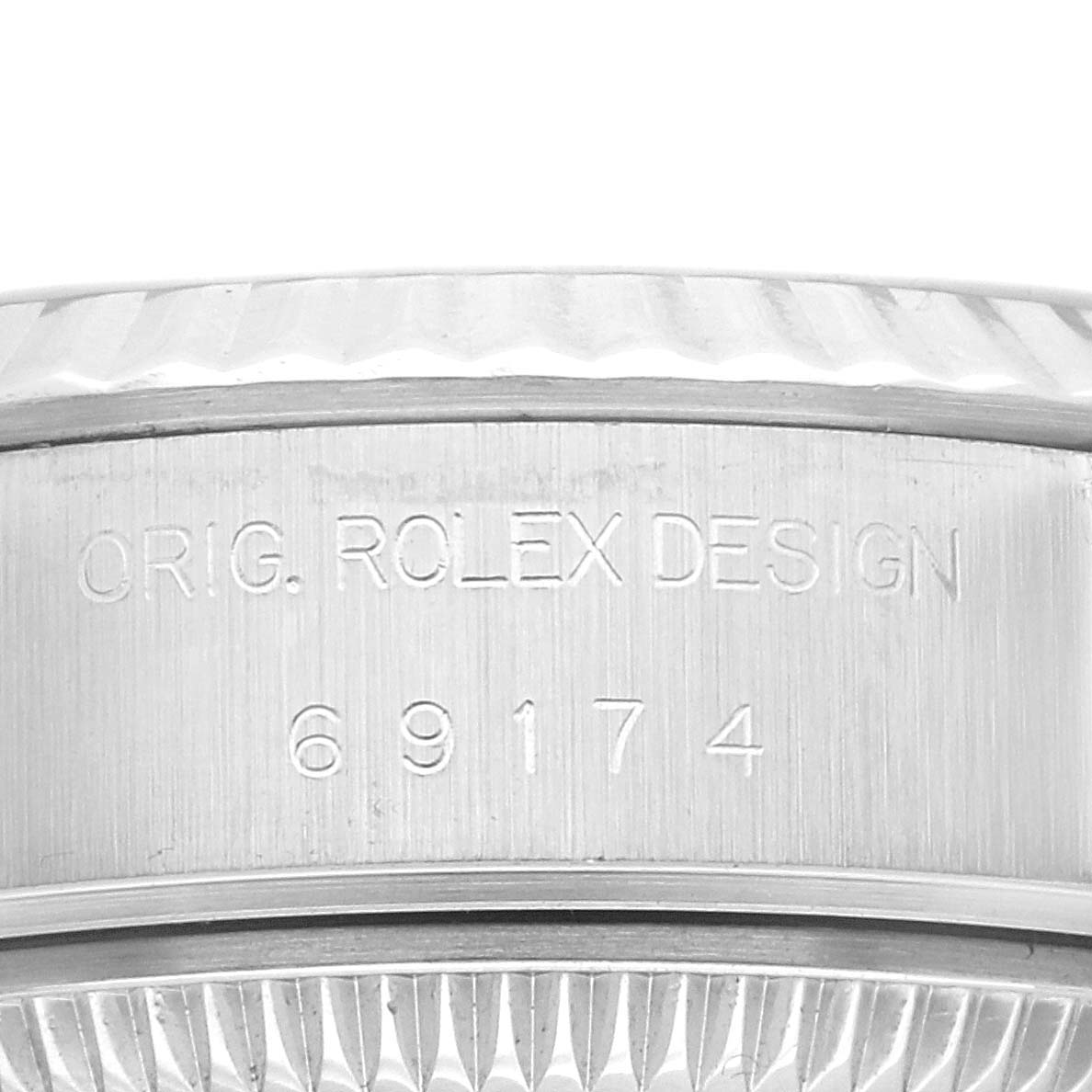 The image shows a close-up of the engraving on the side of the bezel of a Rolex Datejust 69174 Women's Stainless Steel Silver Dial 69174 Women's Stainless Steel Silver Dial watch, displaying the model number.
