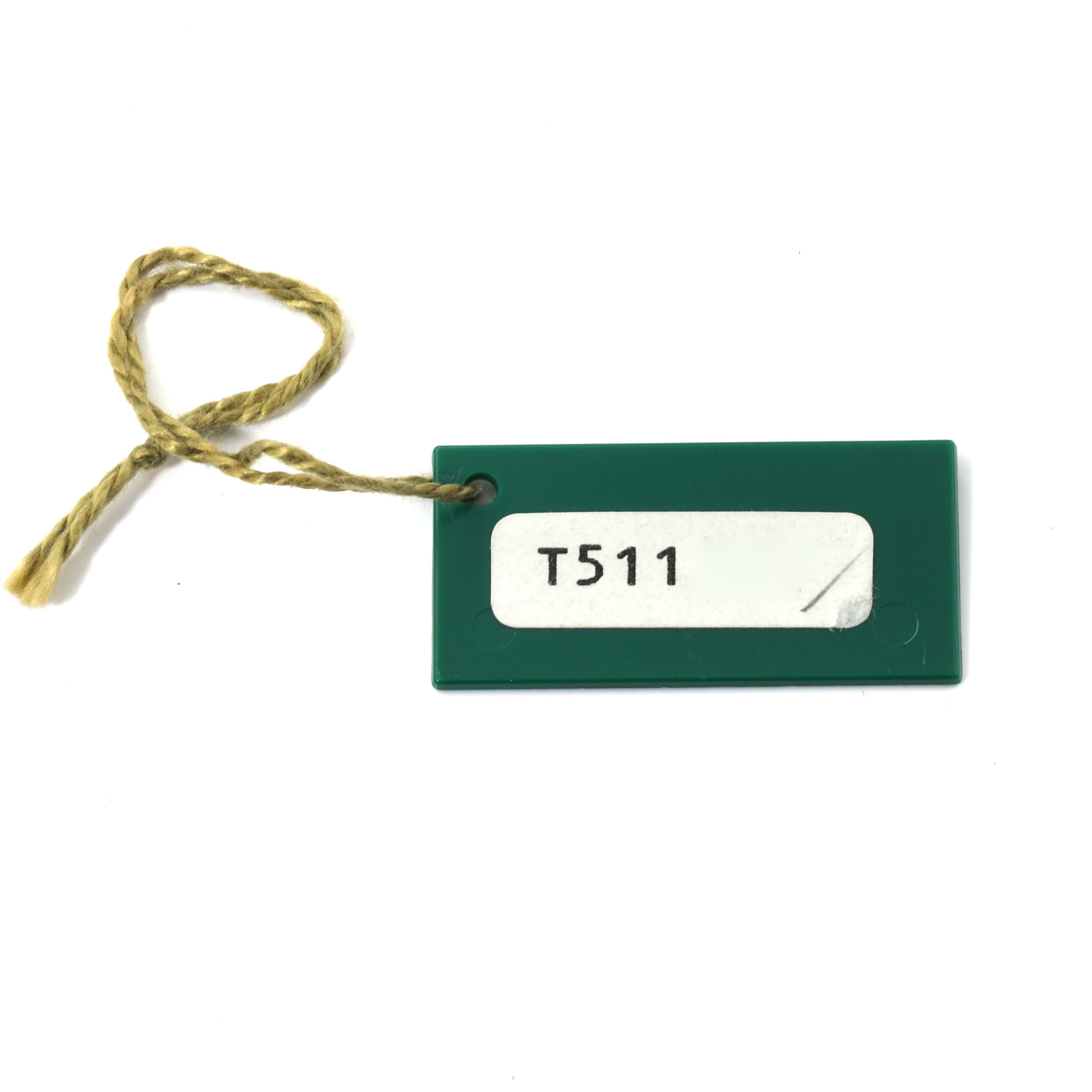 This image shows a green tag with a string and a label that reads "T511," potentially from a Rolex Datejust 69174 Women's Stainless Steel Silver Dial 69174 Women's Stainless Steel Silver Dial watch.