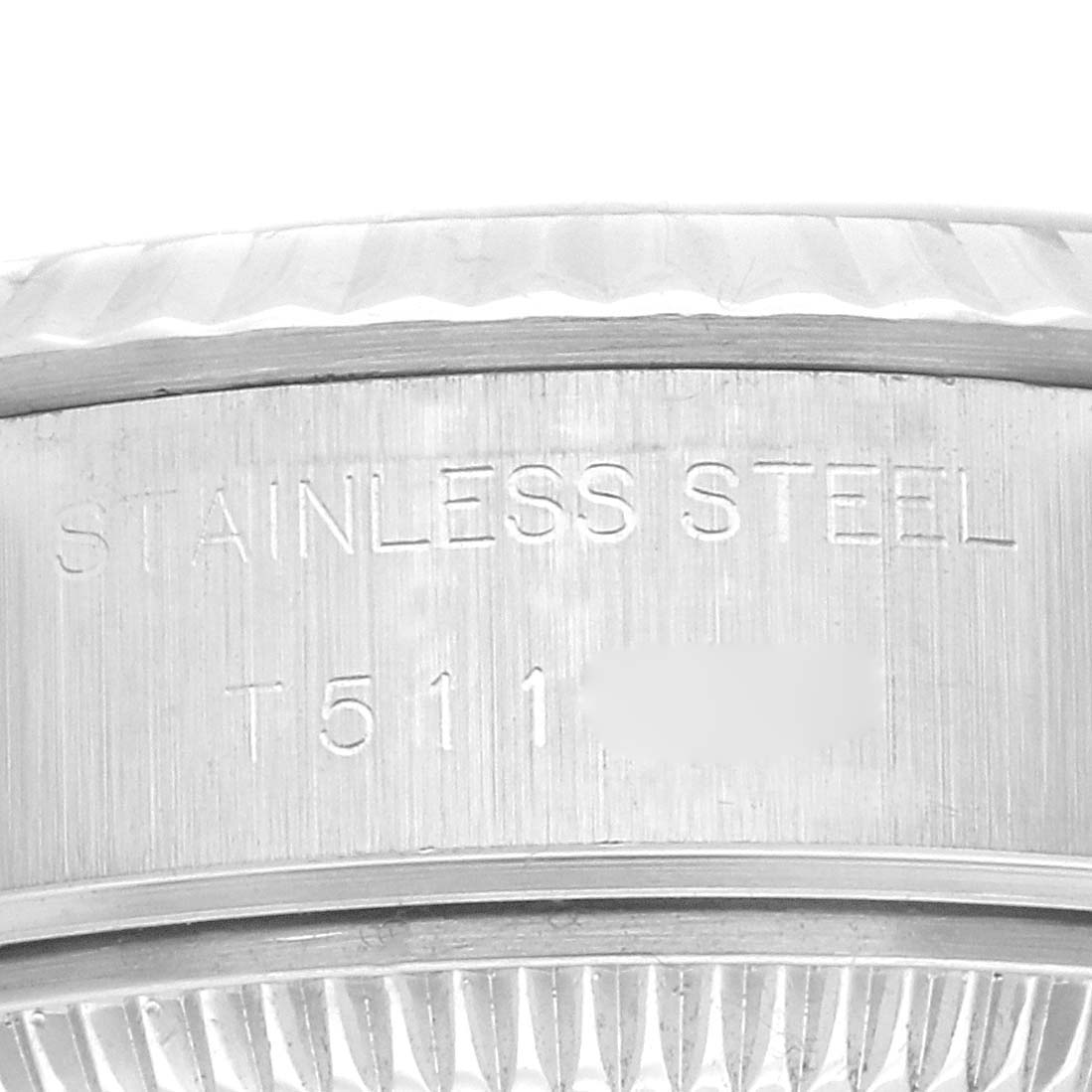 This image shows a close-up side view of the stainless steel casing and serial number of a Rolex Datejust 69174 Women's Stainless Steel Silver Dial 69174 Women's Stainless Steel Silver Dial model watch.
