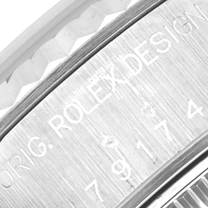 The close-up image shows the flange/inner bezel of a Rolex Datejust 79174 Women's Stainless Steel Mother of Pearl Dial 79174 Women's Stainless Steel Mother of Pearl Dial, revealing part of the serial numbers and the "ORIG. ROLEX DESIGN" engraving.