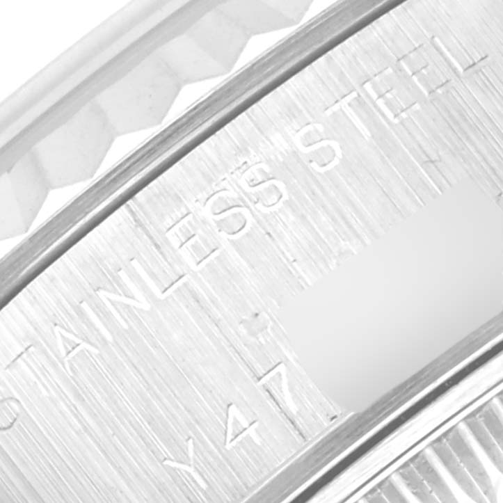 The image shows a close-up of the outer rim with "STAINLESS STEEL" engraved on a Rolex Datejust 79174 Women's Stainless Steel Mother of Pearl Dial 79174 Women's Stainless Steel Mother of Pearl Dial model.