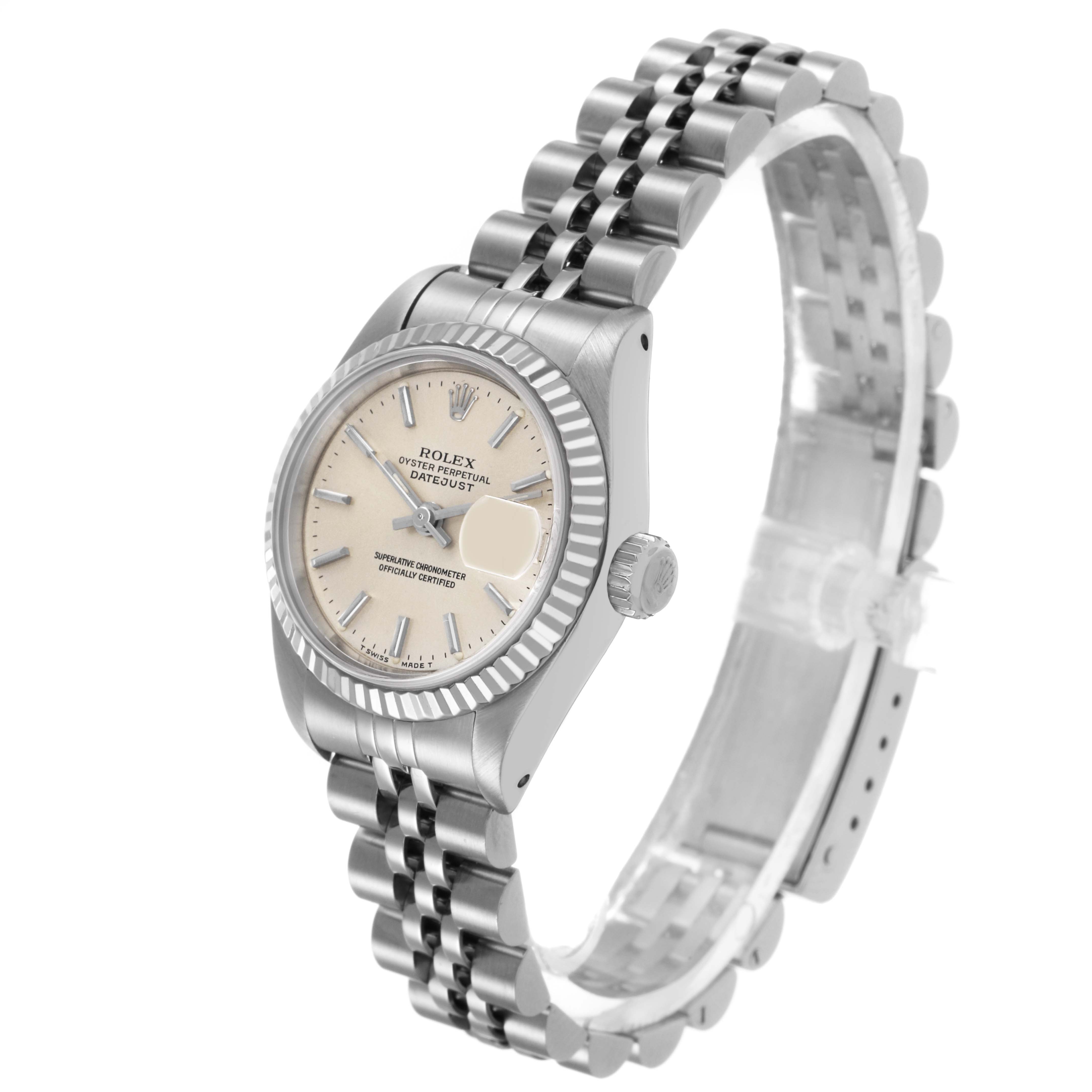 The Rolex Datejust 69174 Women's Stainless Steel Silver Dial watch is shown at a slight angle highlighting the face, bezel, crown, and metal bracelet.