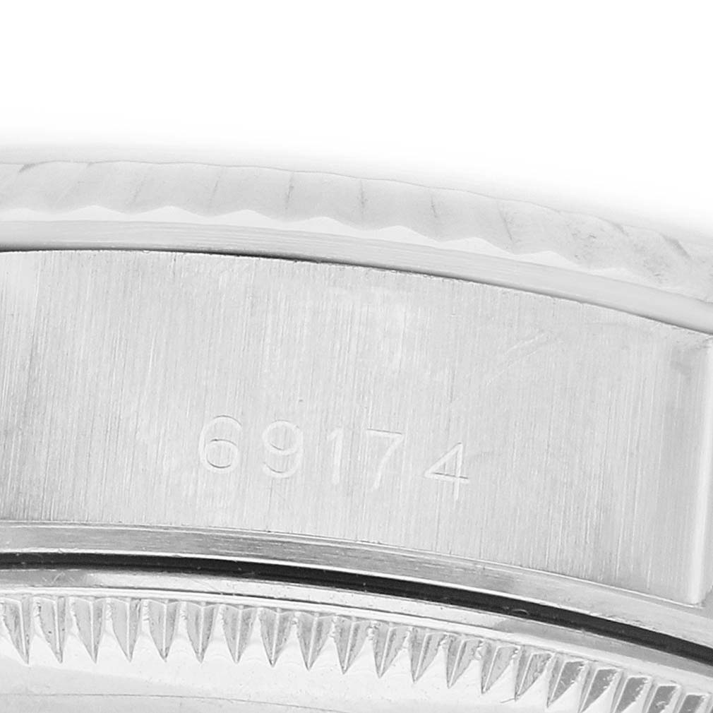 The image shows a close-up of the side of the Rolex Datejust 69174 Women's Stainless Steel Silver Dial watch case, displaying the model number.