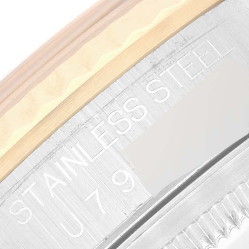 The image shows a close-up angle of the side case of a Rolex Datejust 16233 Men's Steel and Gold (two tone) Black Dial 16233 Men's Steel and Gold (two tone) Black Dial watch, highlighting the "STAINLESS STEEL" engraving.