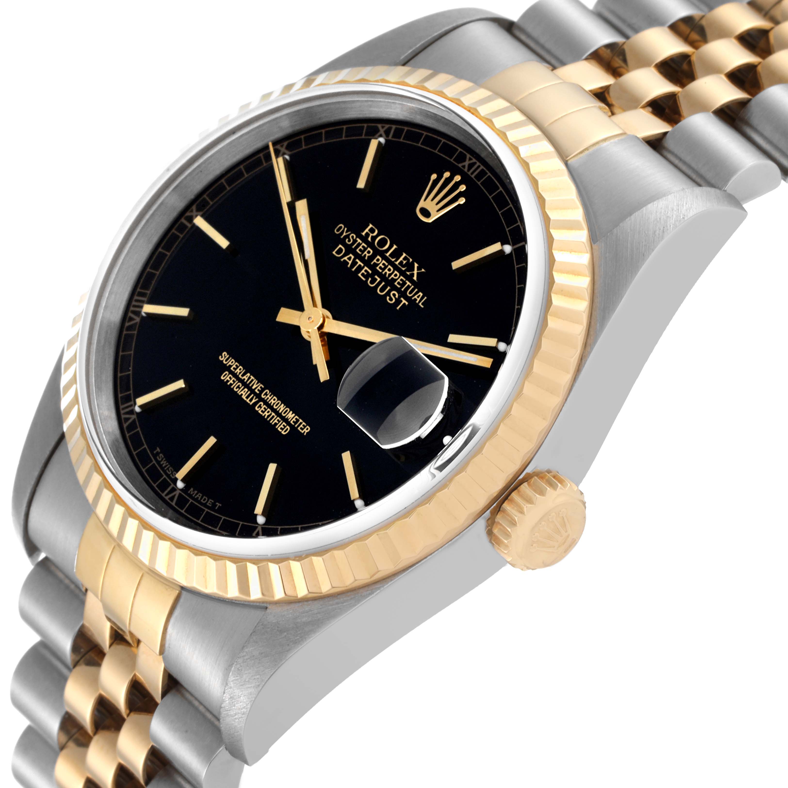 The image shows a close-up angle of a Rolex Datejust 16233 Men's Steel and Gold (two tone) Black Dial 16233 Men's Steel and Gold (two tone) Black Dial watch displaying the dial, bezel, crown, and part of the bracelet.