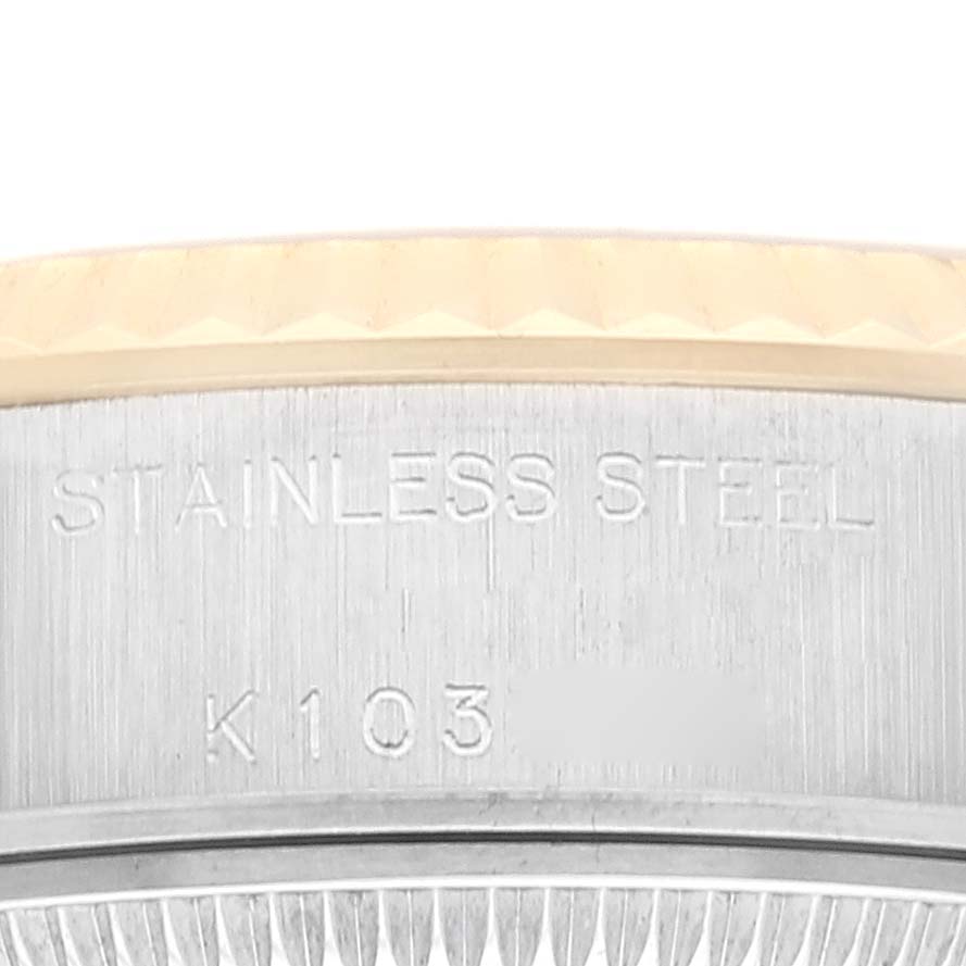 This close-up image shows the side of the bezel and the case of the Rolex Datejust 79173 Women's Steel and Gold (two tone) Champagne Dial 79173 Women's Steel and Gold (two tone) Champagne Dial, highlighting the "STAINLESS STEEL" engraving.