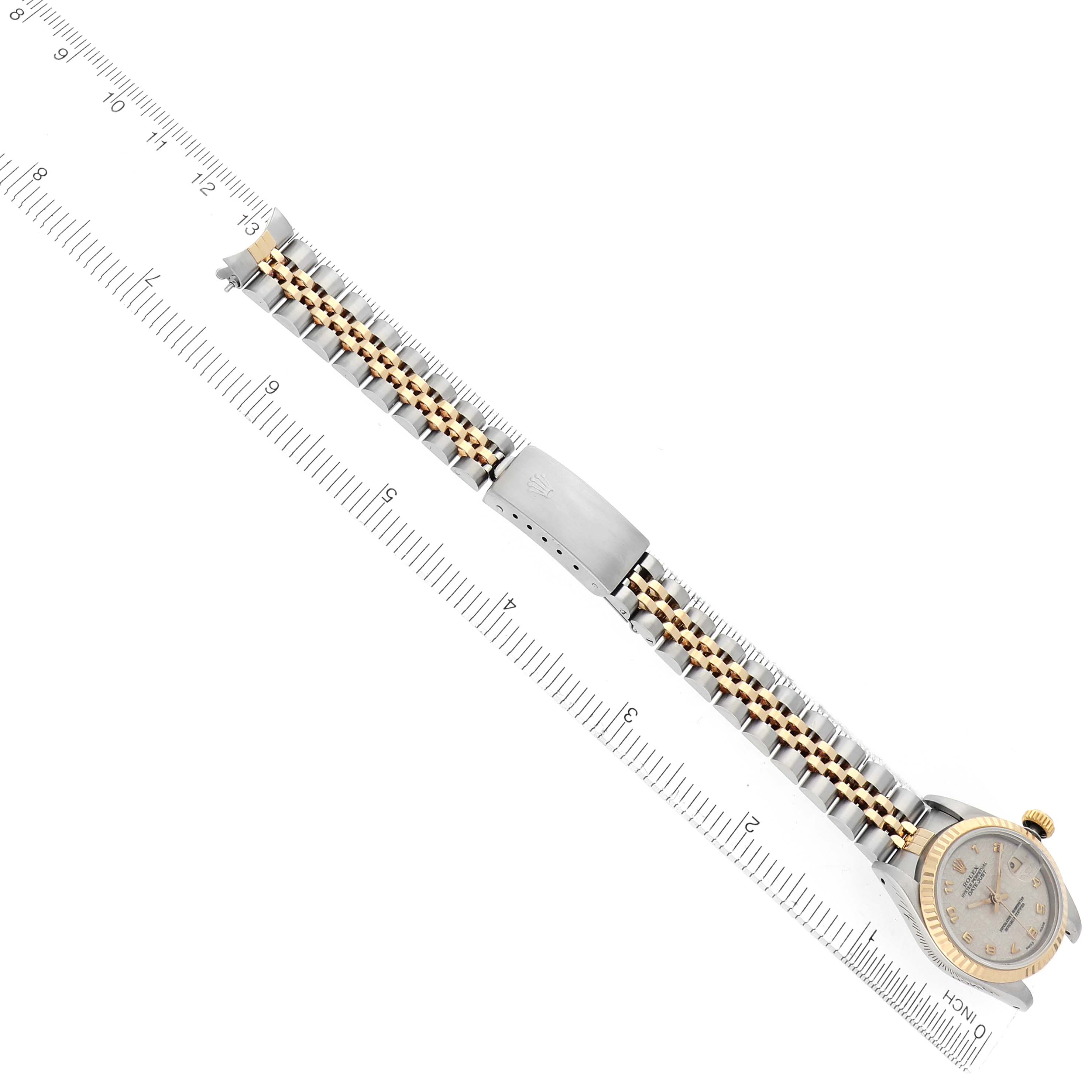 The Rolex Datejust 69173 Women's Steel and Gold (two tone) White Dial 69173 Women's Steel and Gold (two tone) White Dial watch is shown from a top-down angle, displaying its full bracelet, clasp, and part of the dial.