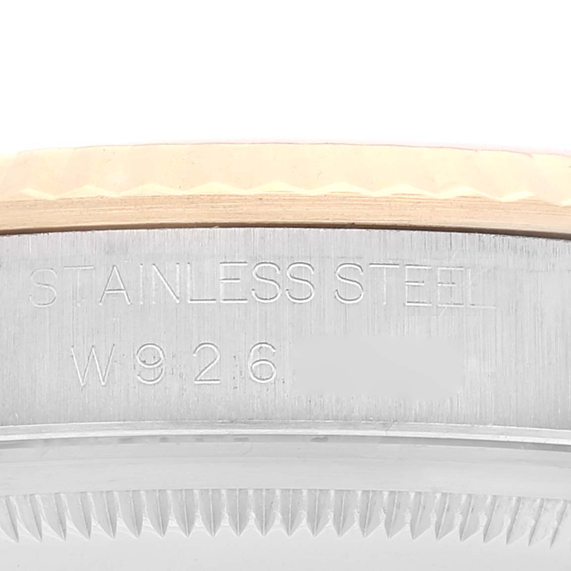 This image shows a close-up of the side of a Rolex Datejust 16233 Men's Steel and Gold (two tone) White Dial 16233 Men's Steel and Gold (two tone) White Dial watch case, displaying the stainless steel engraving and part of the bezel.