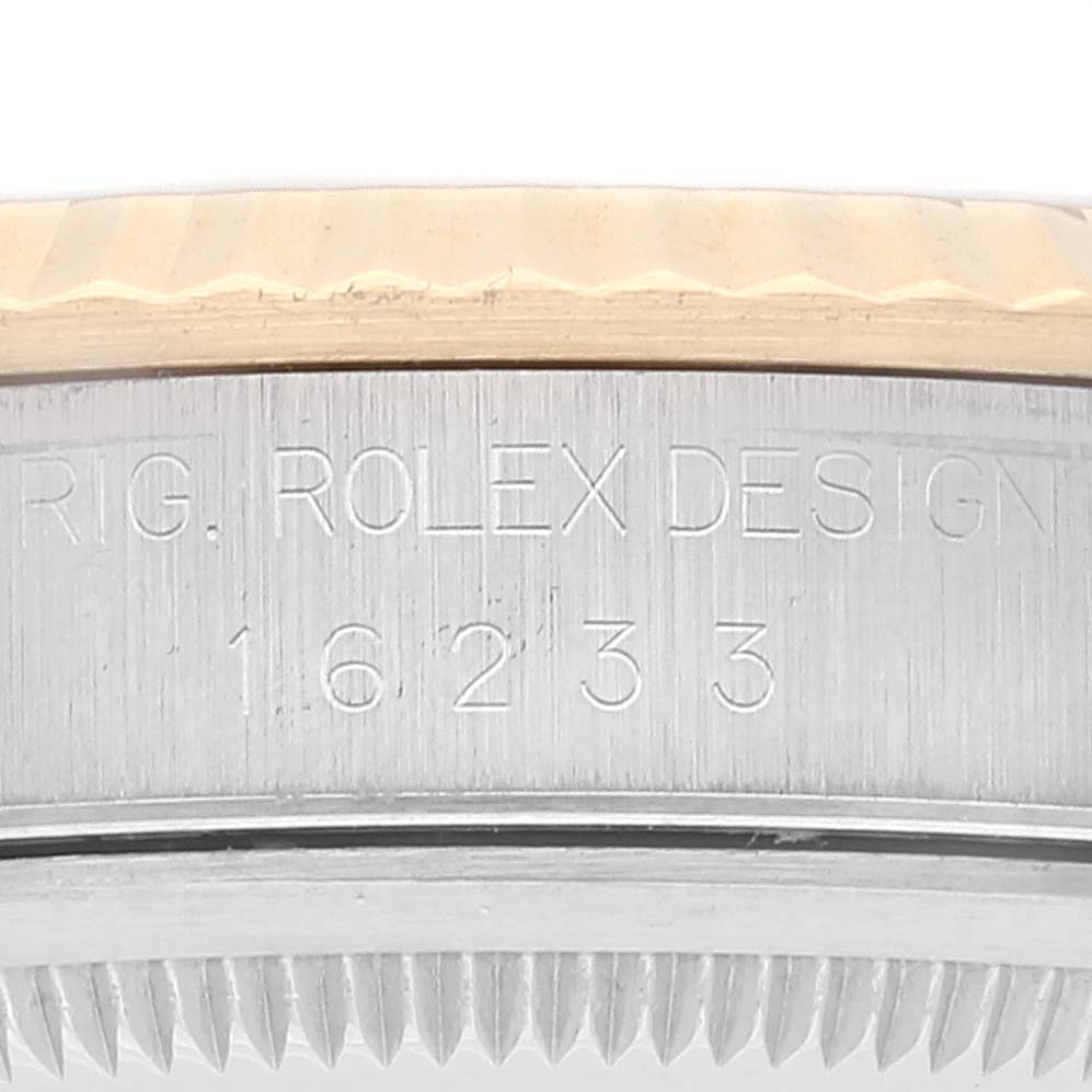 The image shows a close-up view of the case side and fluted bezel of a Rolex Datejust 16233 Men's Steel and Gold (two tone) White Dial 16233 Men's Steel and Gold (two tone) White Dial, with the serial number and "Rolex Design" inscription.