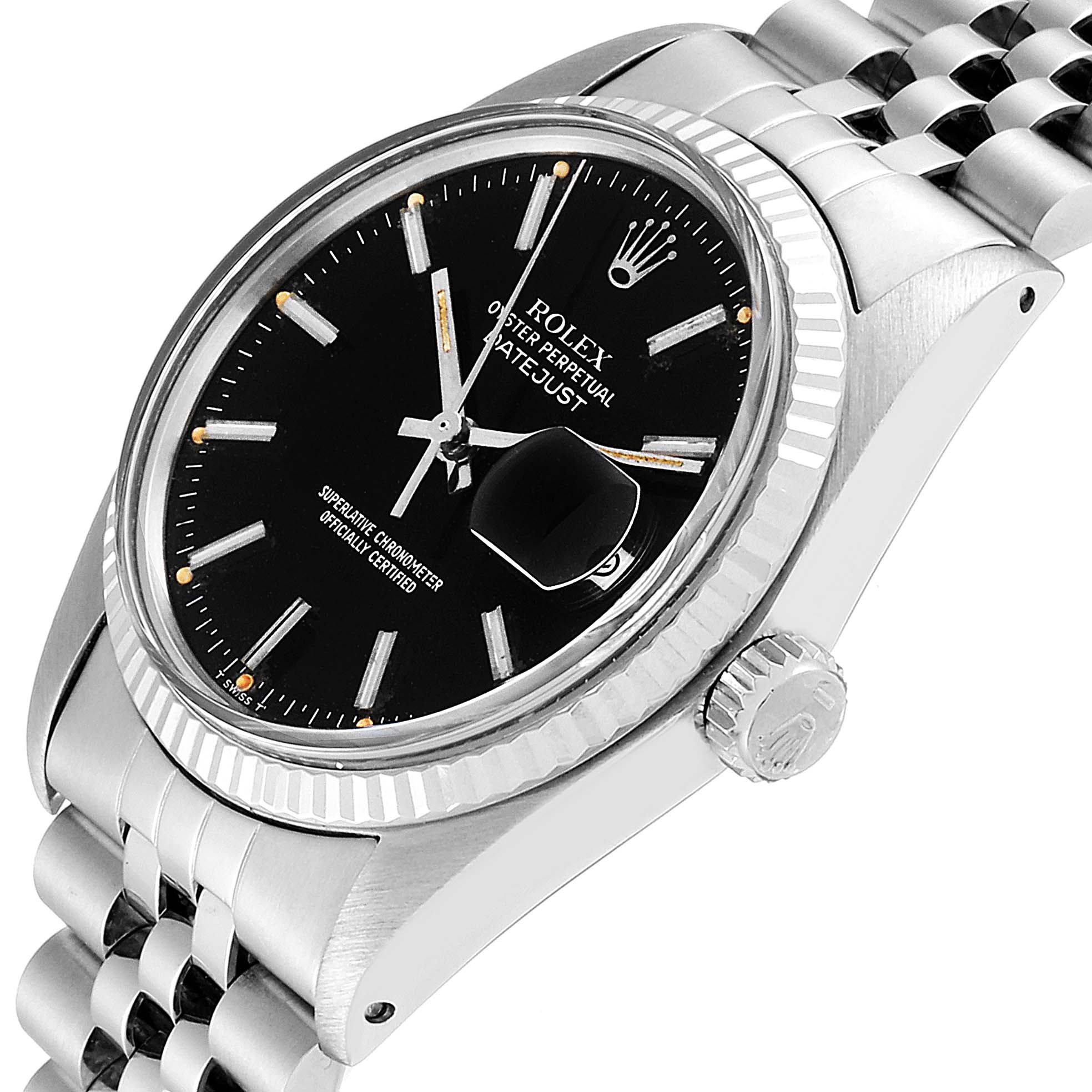 The Vintage Collection Rolex watch is shown from a side angle, displaying the face, crown, bezel, and part of the bracelet.