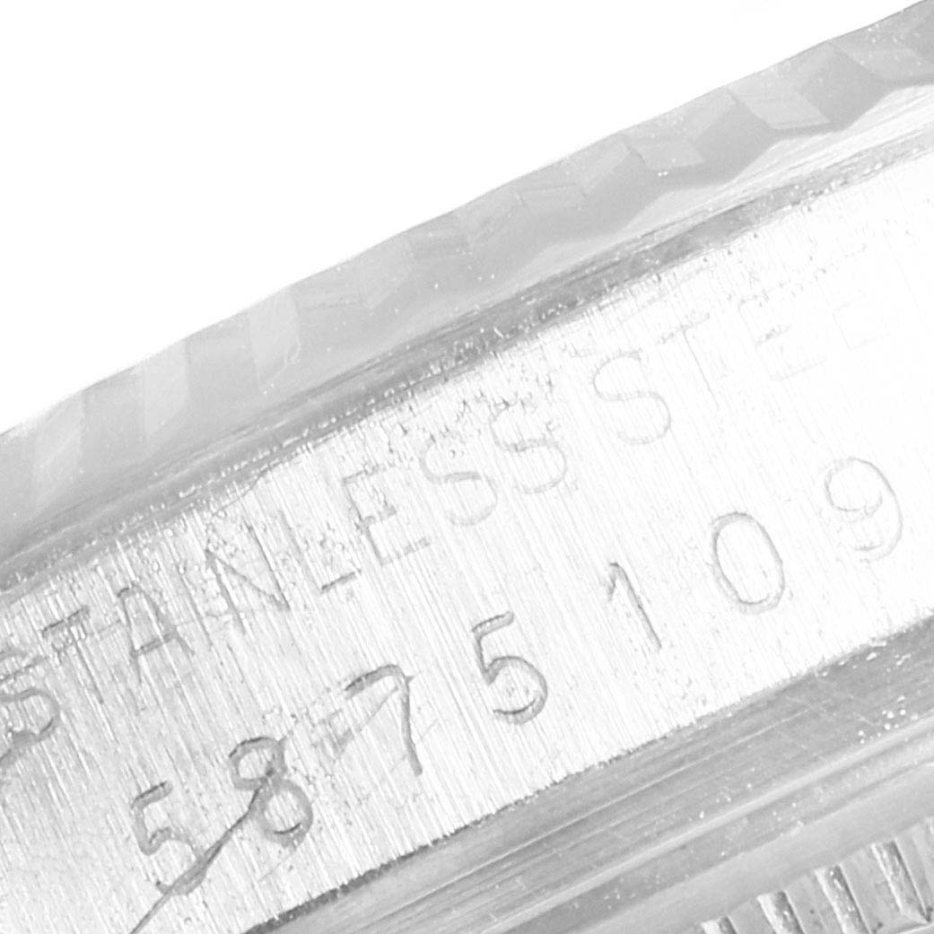 This close-up image shows the etched details on the bezel and case edge of a Rolex Vintage Collection 16014 Men's Stainless Steel Black Dial 16014 Men's Stainless Steel Black Dial watch.