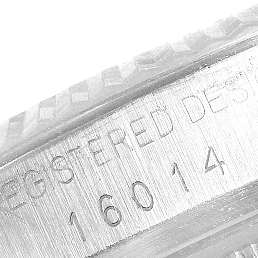 This image shows a close-up of the side of a Rolex Vintage Collection 16014 Men's Stainless Steel Black Dial 16014 Men's Stainless Steel Black Dial watch, featuring the model number and engravings.