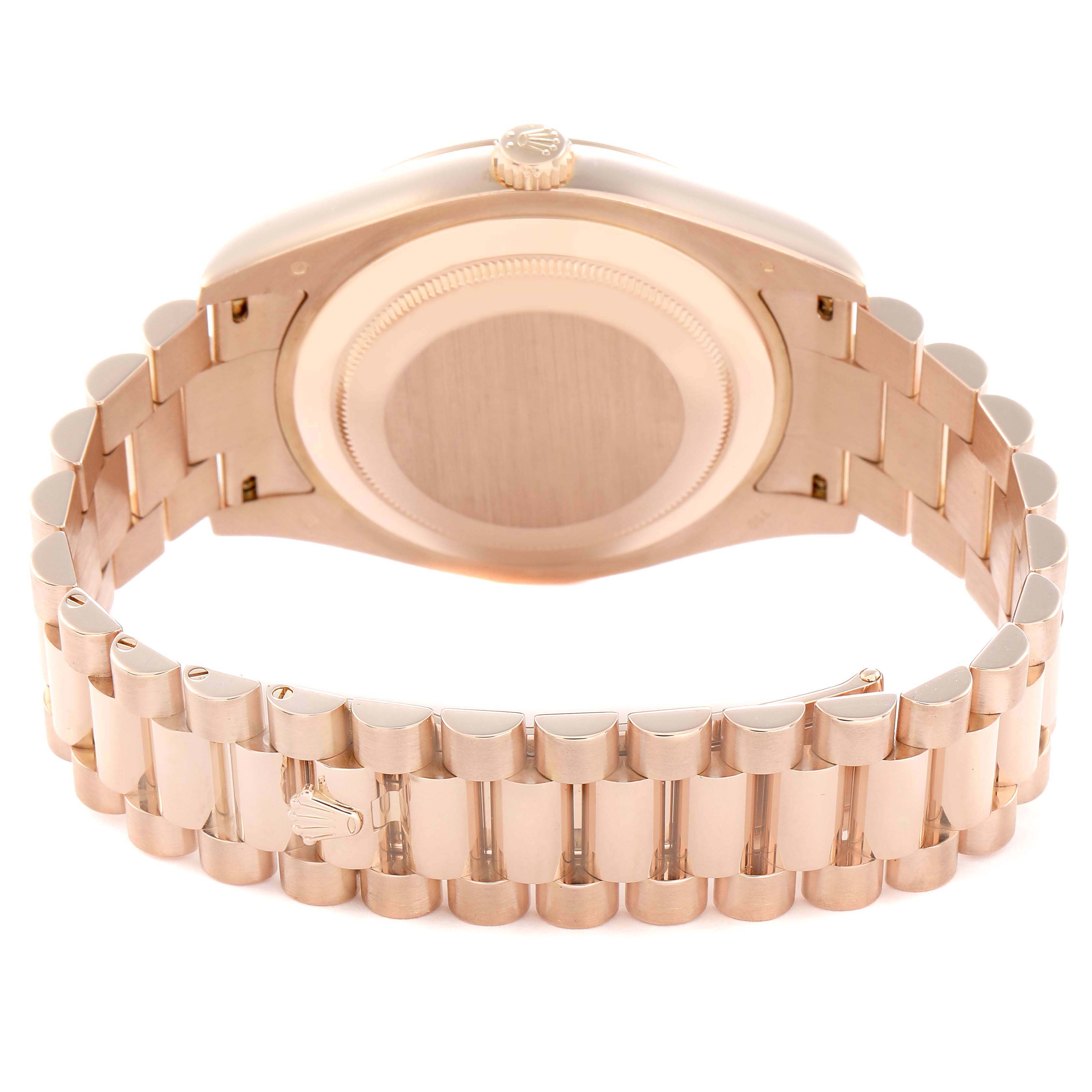 The image shows the back case and bracelet of a Rolex President 218235 Men
s Rose Gold Pink Dial 218235 Men
s Rose Gold Pink Dial model, viewed from behind.