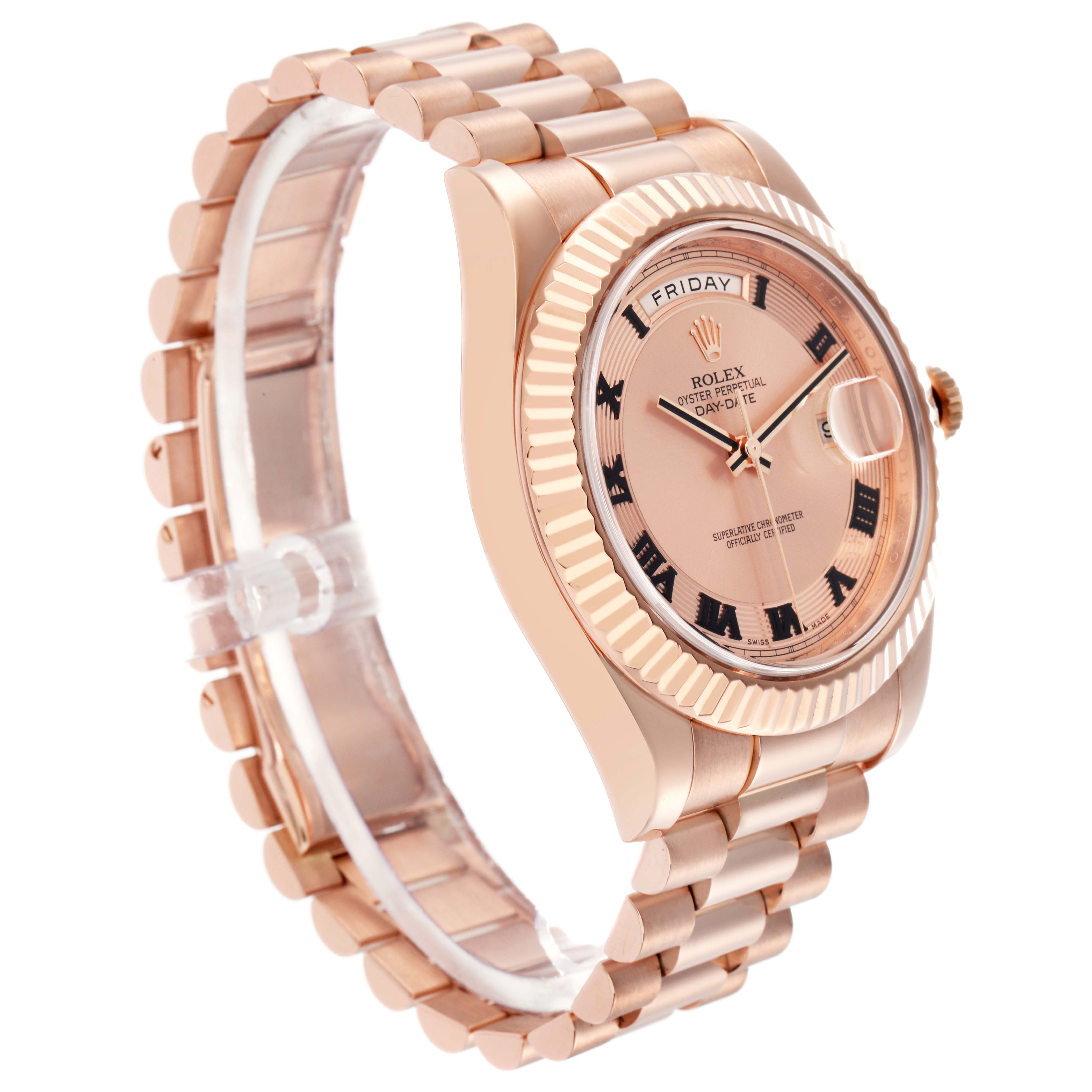 The Rolex President 218235 Men
s Rose Gold Pink Dial 218235 Men
s Rose Gold Pink Dial model watch is shown at an angle highlighting the case, dial, fluted bezel, and bracelet.