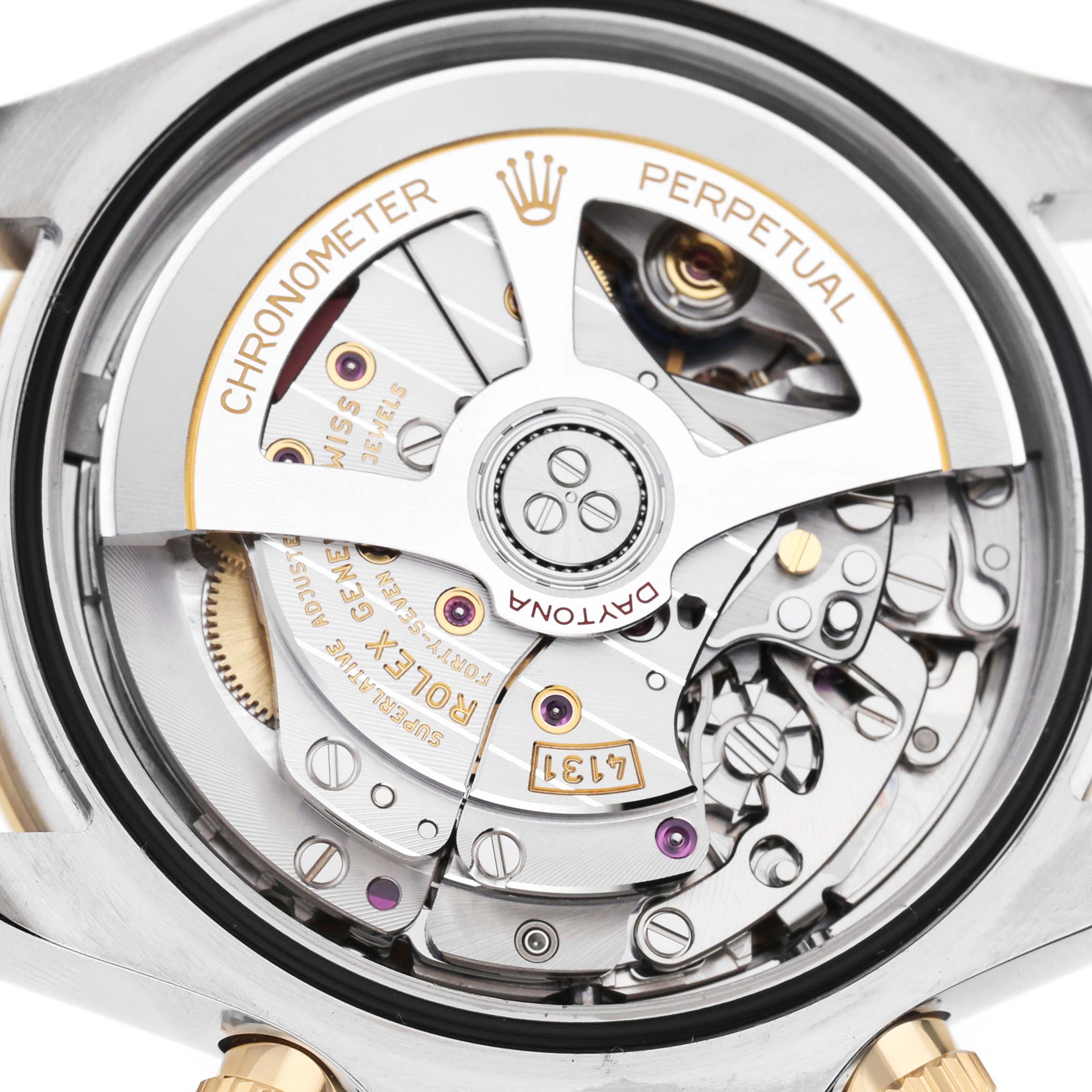 The image shows a detailed view of the Rolex Daytona 126503 Men's Steel and Gold (two tone) Black Dial's movement from the back, highlighting the intricate components and engravings.