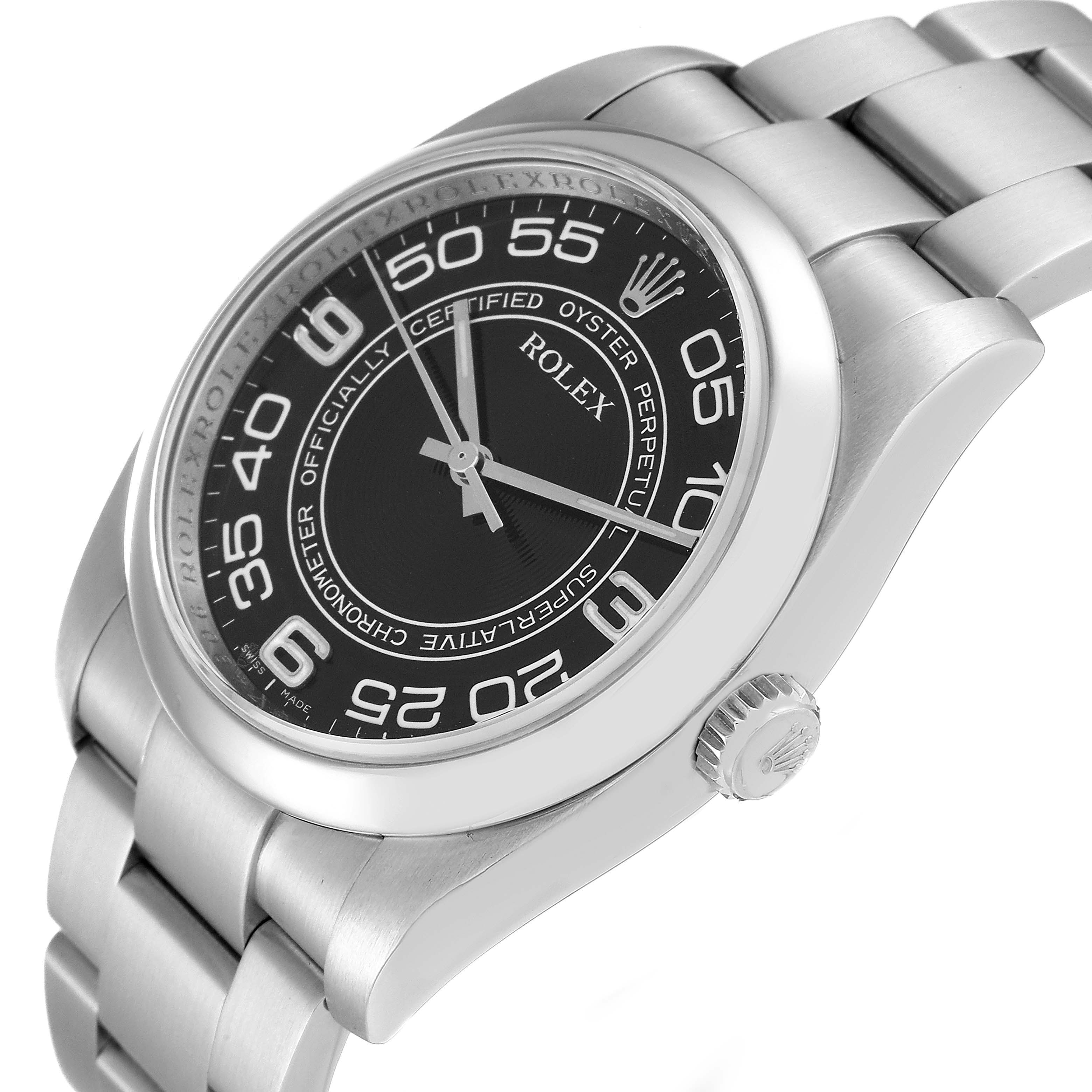 The image shows a side angle view of a Rolex Oyster Perpetual 116000 Men's Stainless Steel Black Dial 116000 Men's Stainless Steel Black Dial watch, highlighting the dial, bezel, crown, and bracelet.