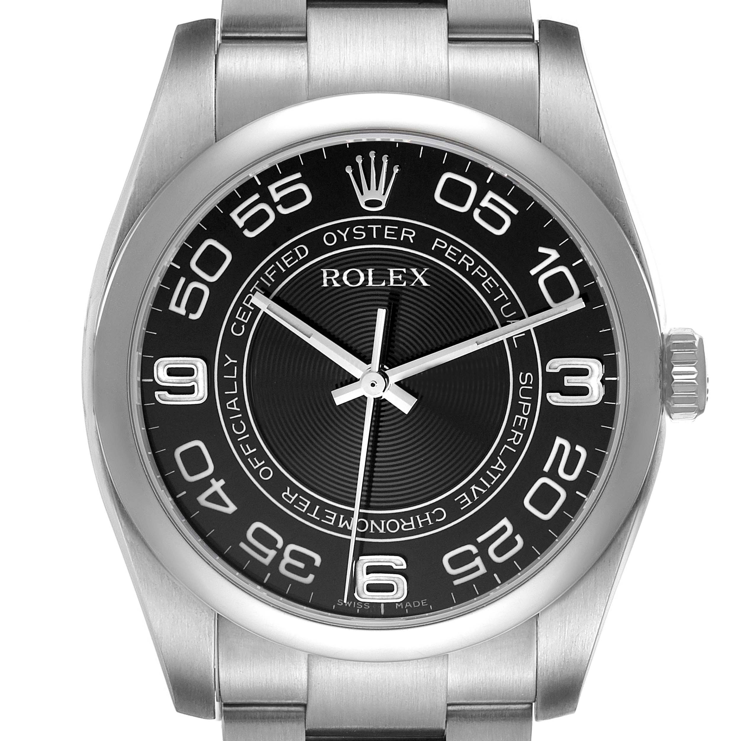 The image shows a frontal view of a Rolex Oyster Perpetual 116000 Men's Stainless Steel Black Dial 116000 Men's Stainless Steel Black Dial watch, highlighting the dial, bezel, and part of the bracelet.