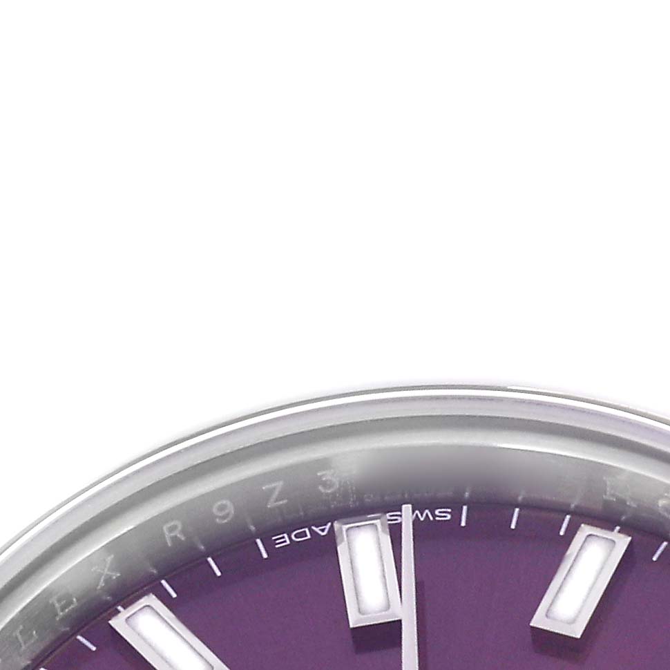 The image shows a partial close-up of the Rolex Oyster Perpetual 176200 Women
s Stainless Steel Purple Dial 176200 Women
s Stainless Steel Purple Dial watch face, focusing on the dial and hour markers.