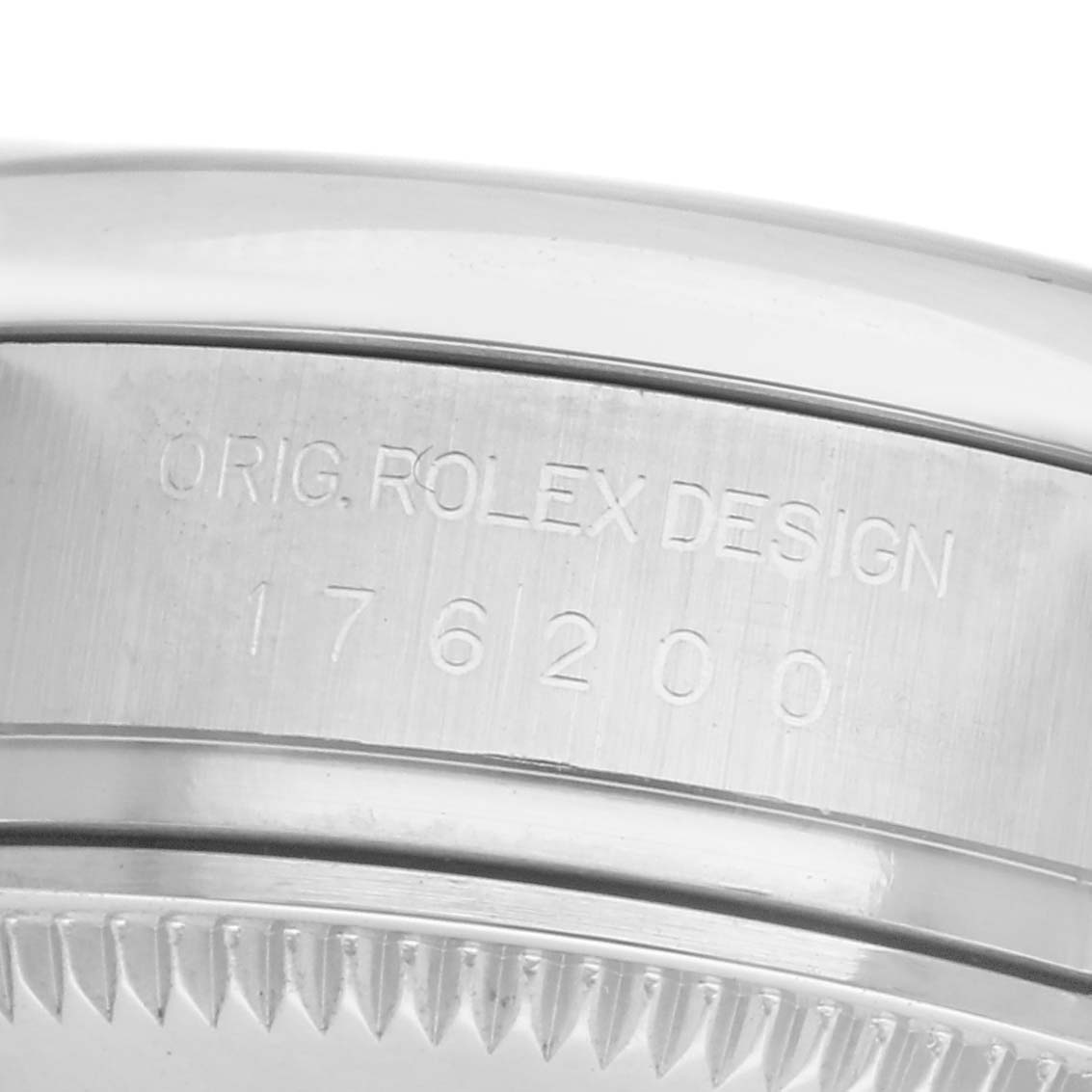 The image shows the side engraving on the bezel of a Rolex Oyster Perpetual 176200 Women
s Stainless Steel Purple Dial 176200 Women
s Stainless Steel Purple Dial watch, displaying design and model numbers.