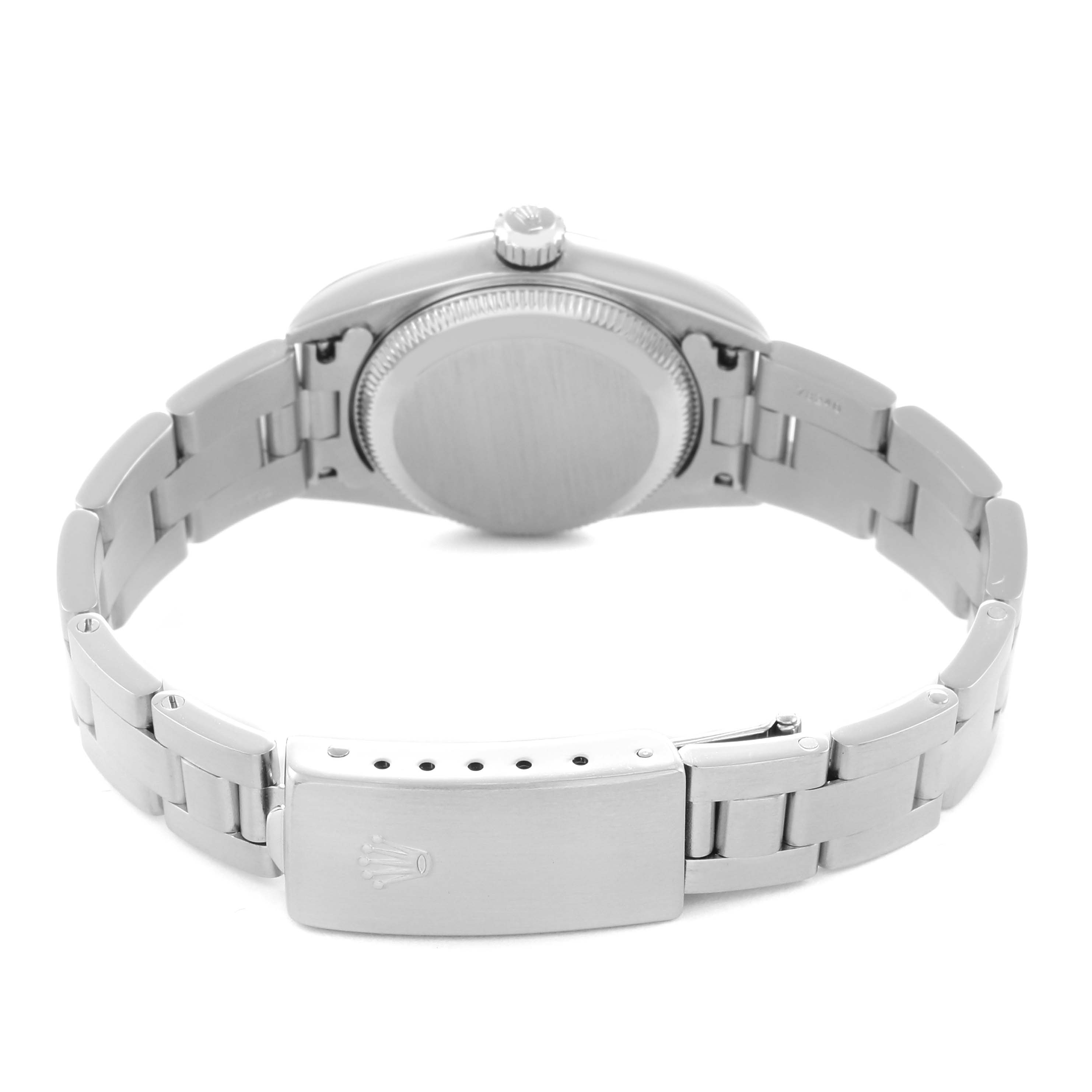 The image shows the back of the Rolex Oyster Perpetual 76080 Women's Stainless Steel Silver Dial 76080 Women's Stainless Steel Silver Dial watch, highlighting the case back, bracelet, and clasp.