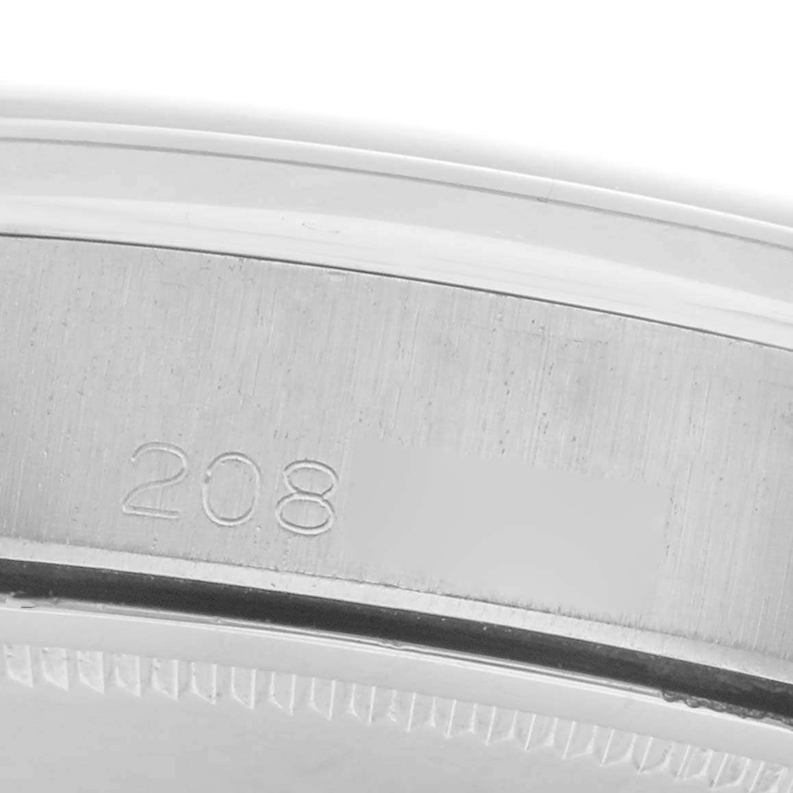 The image shows the engraved side of the case back of a Rolex Vintage Collection 6694 Men
s Stainless Steel Silver Dial 6694 Men
s Stainless Steel Silver Dial watch.